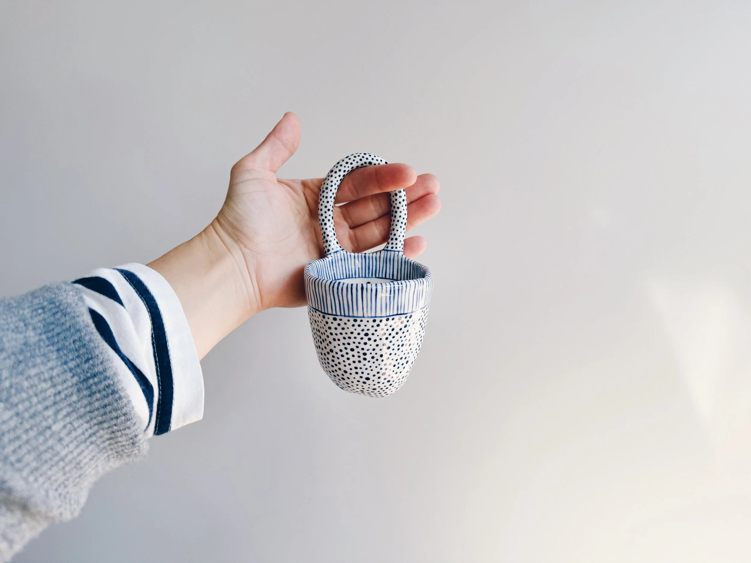 Blue and white, handmade ceramic vessel.