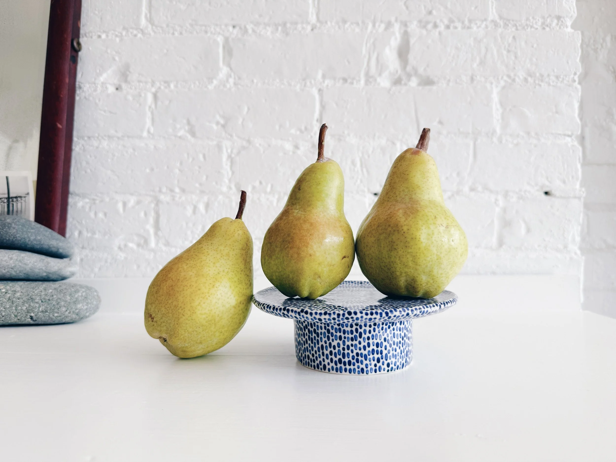 Blue and white, handmade ceramic raised plate.