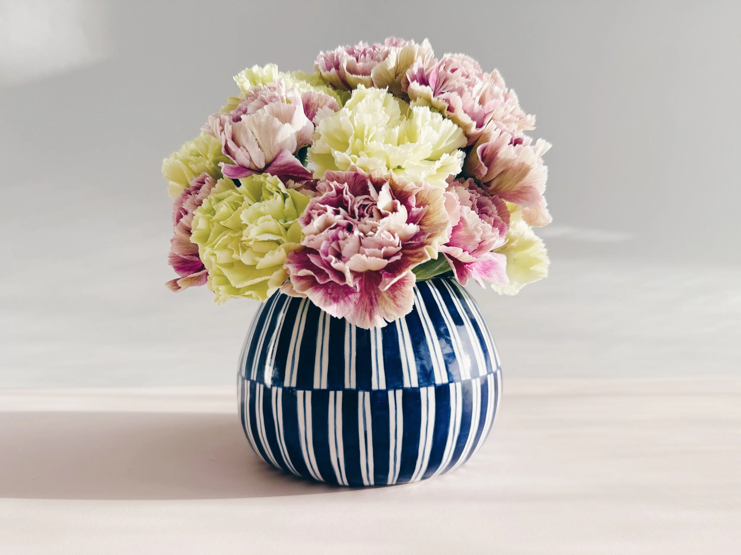 Blue and white, handmade ceramic vase.