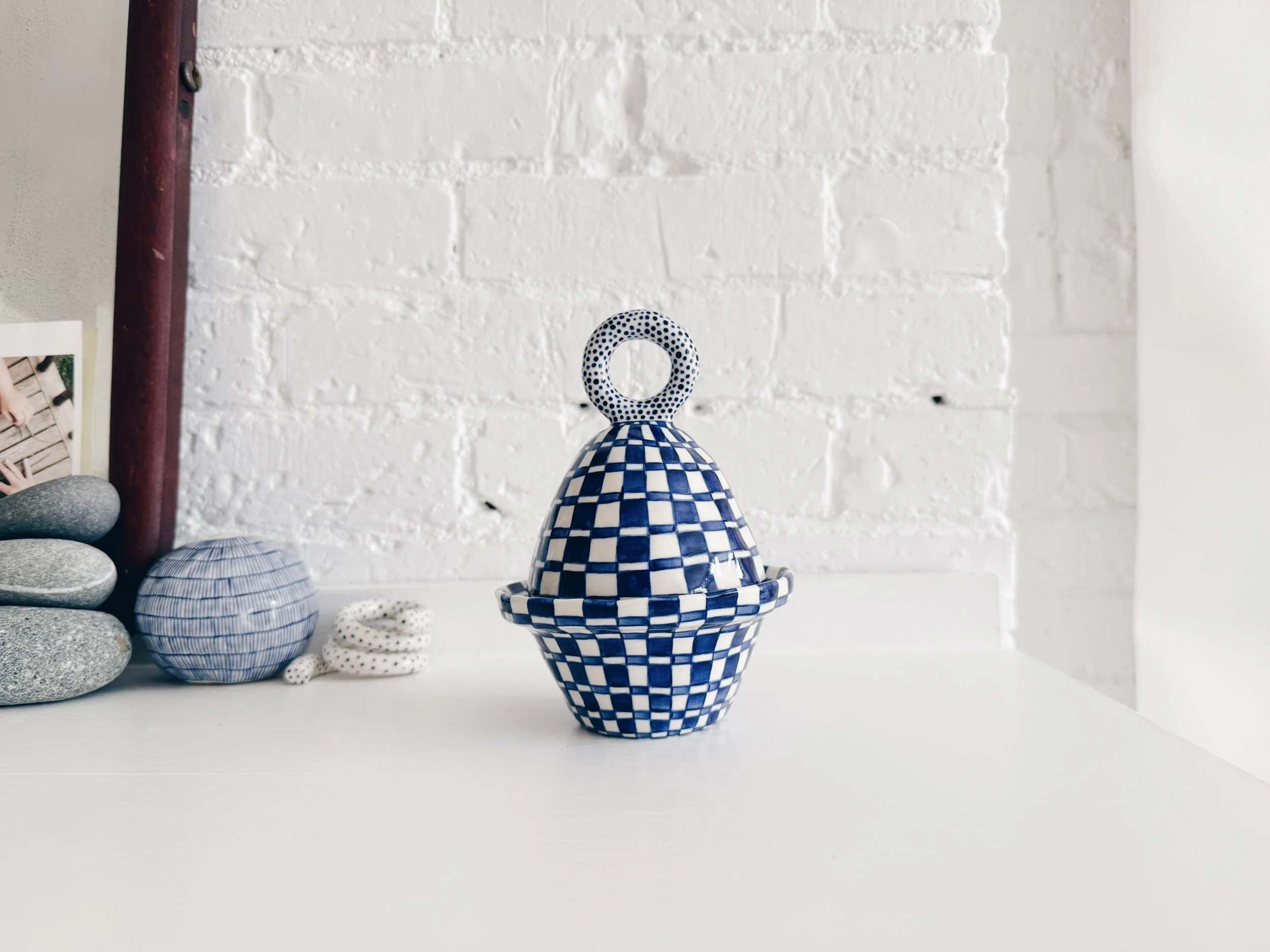 Blue and white, handmade ceramic jar.