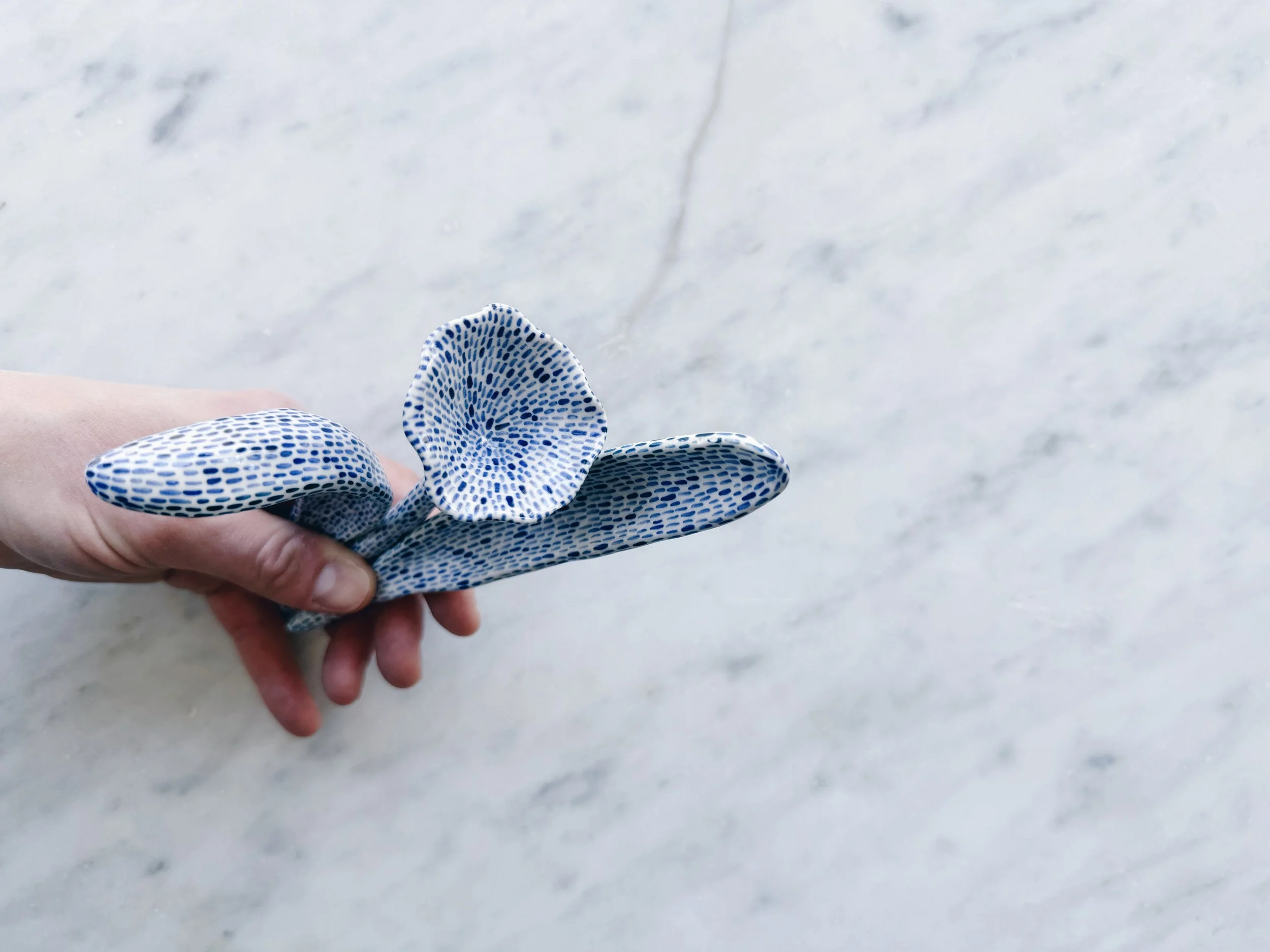 Blue and white, handmade ceramic sculpture.