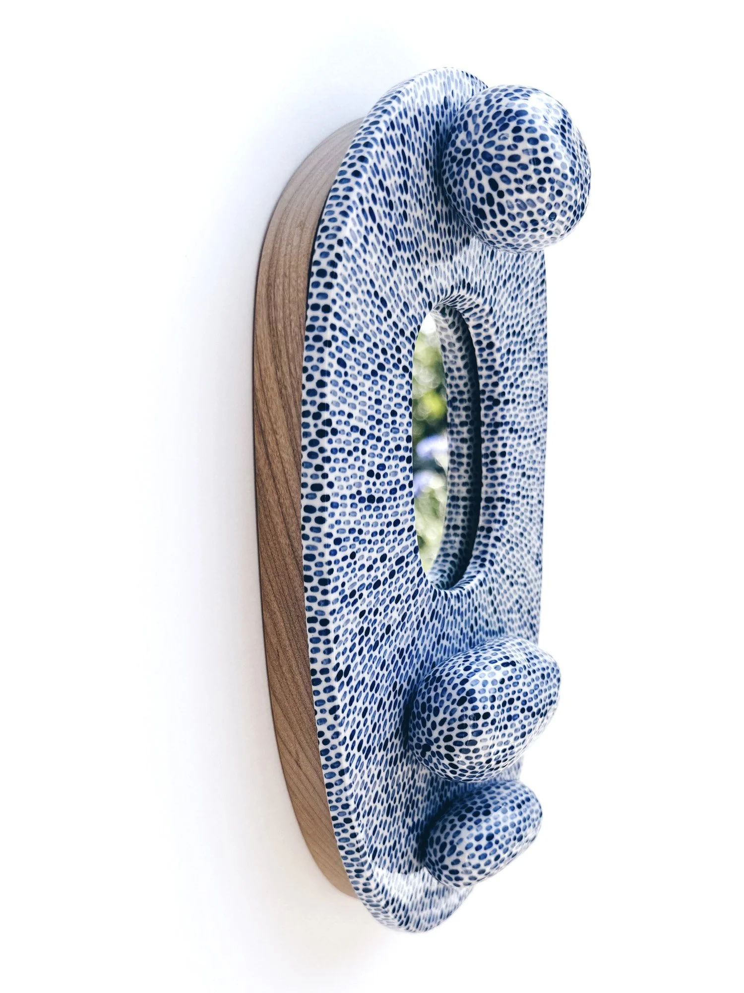 Blue and white, handmade ceramic mirror.