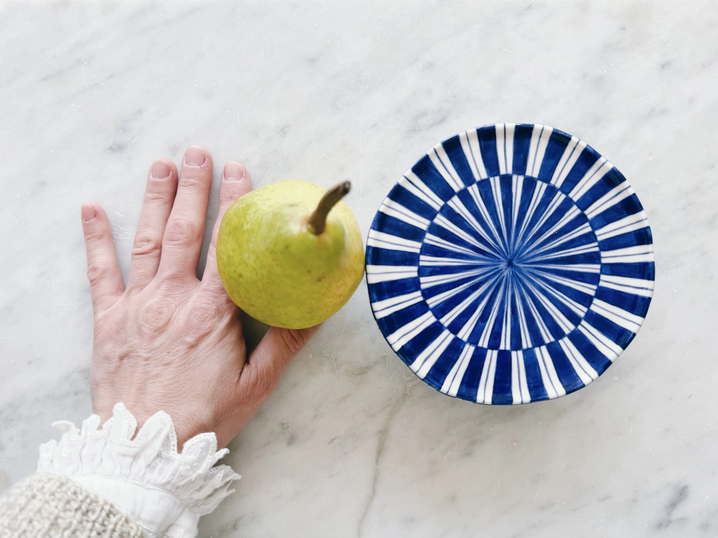 Blue and white, handmade ceramic raised plate.