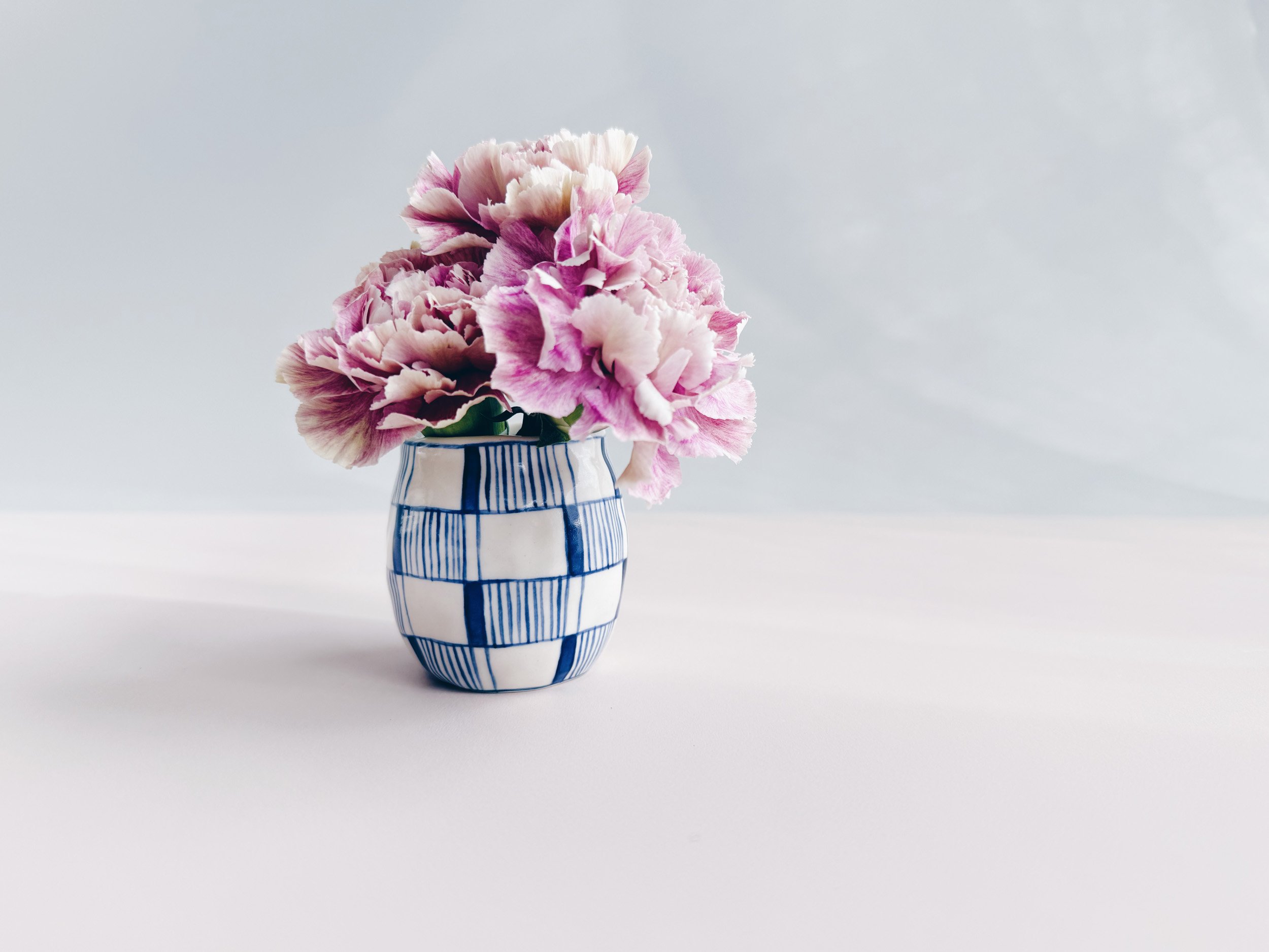 Blue and white, handmade ceramic vase.