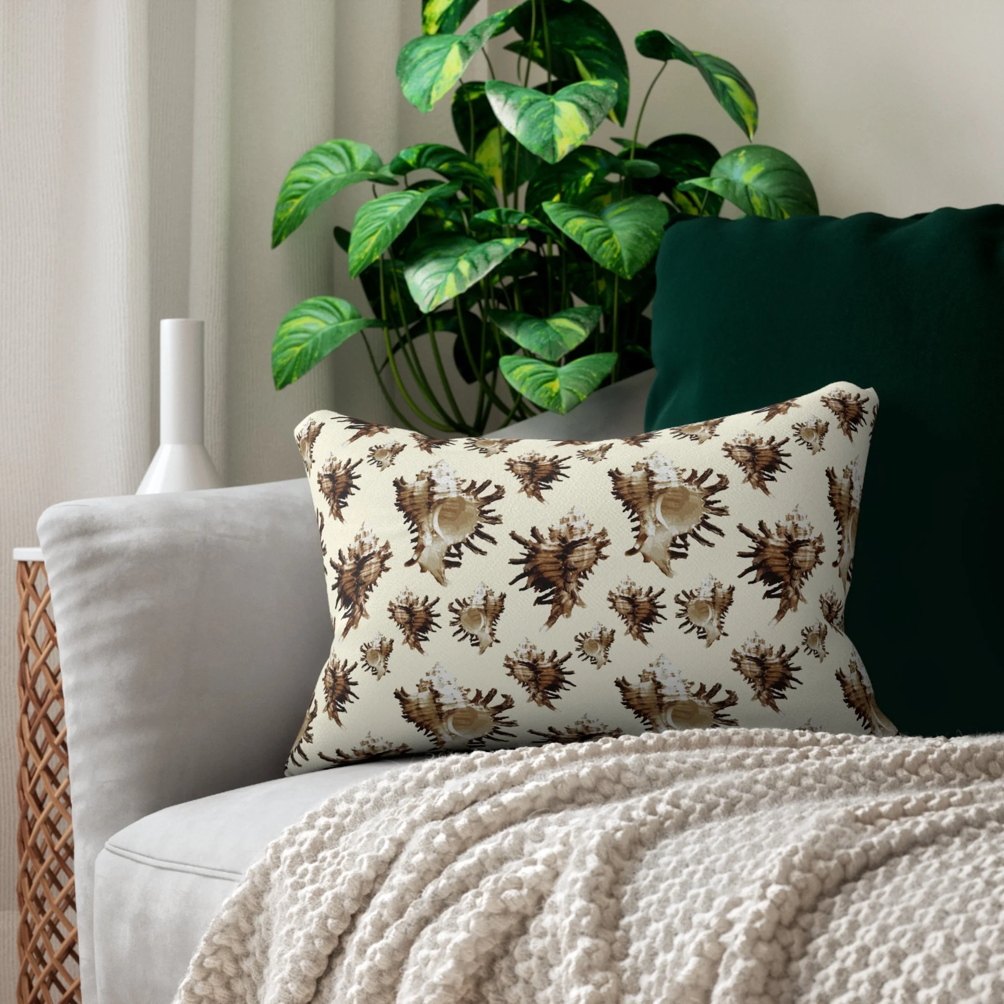Spiky Conches (on Very Pale Yellow) - Lumbar Pillow on Couch.png
