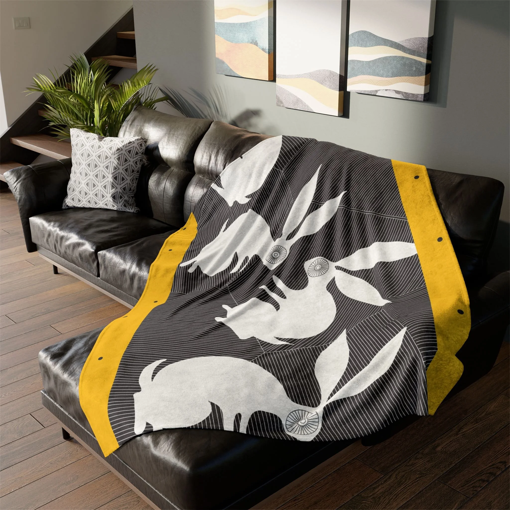 Stone Rabbits by Elisabeth Maurland - Fleece Blanket on Couch 1.png
