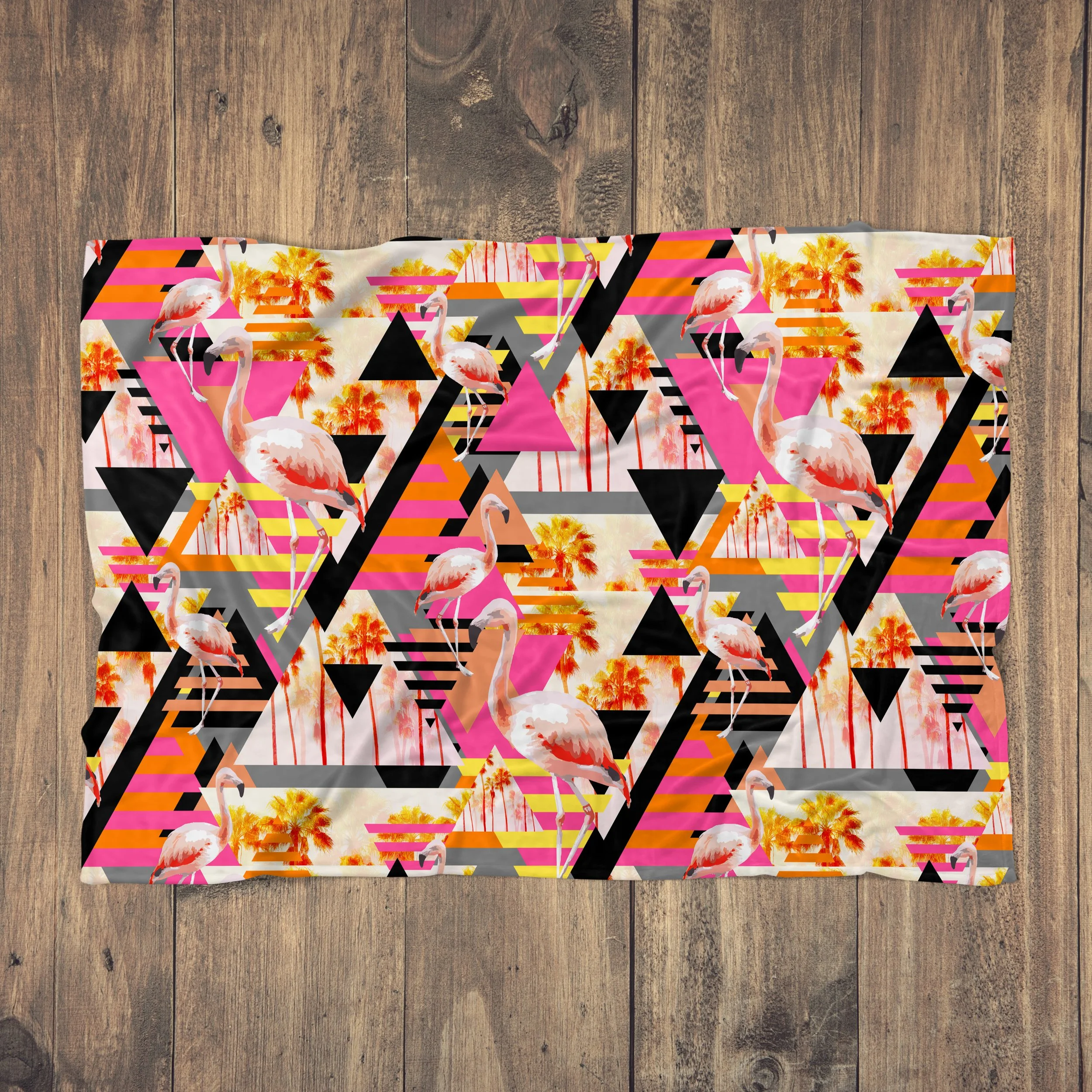 Sunset Flamingos - Fleece Blanket on Wood Floor.jpg