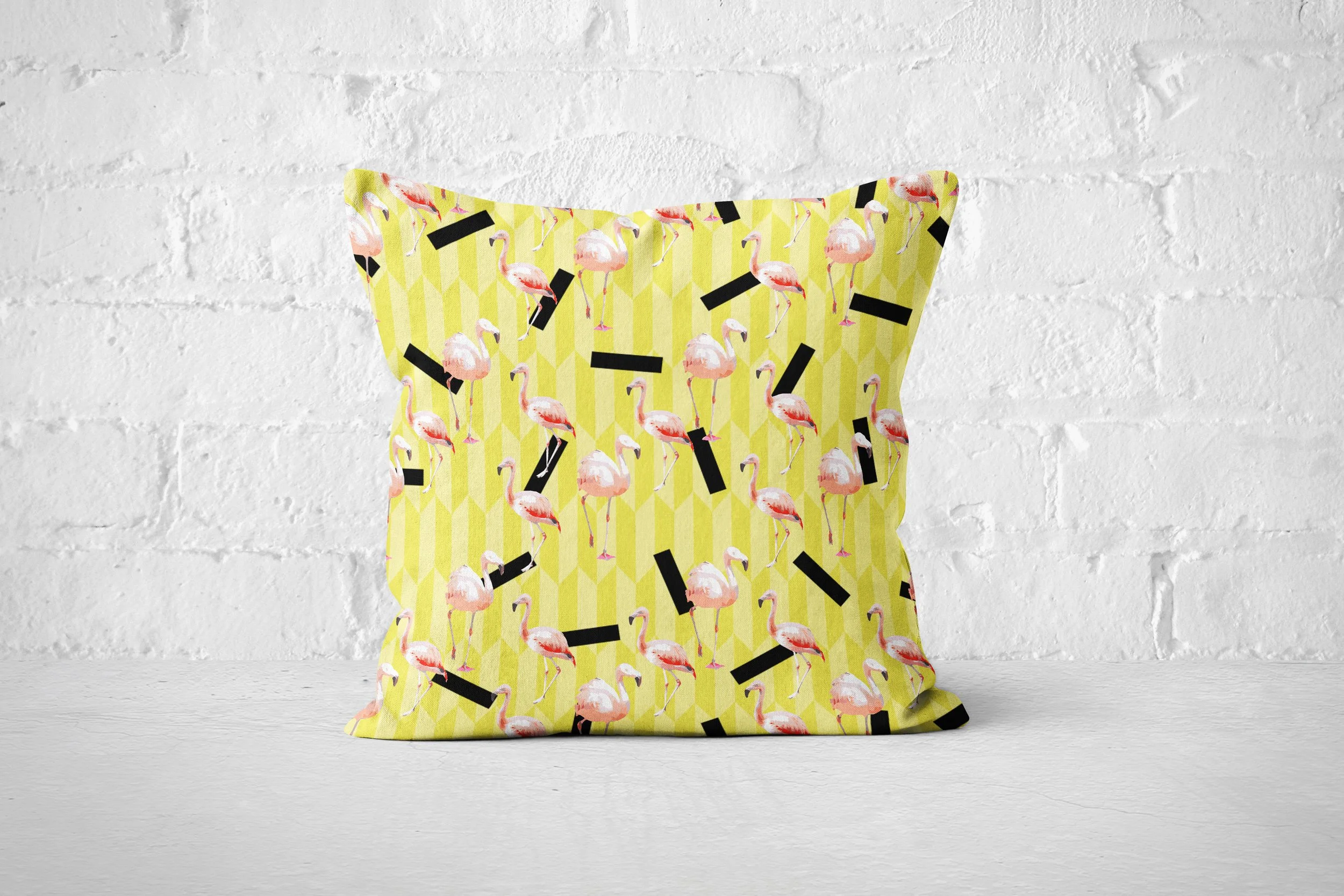 Lemon Flamingos - Pillow on Floor (Brick Wall Background).jpg