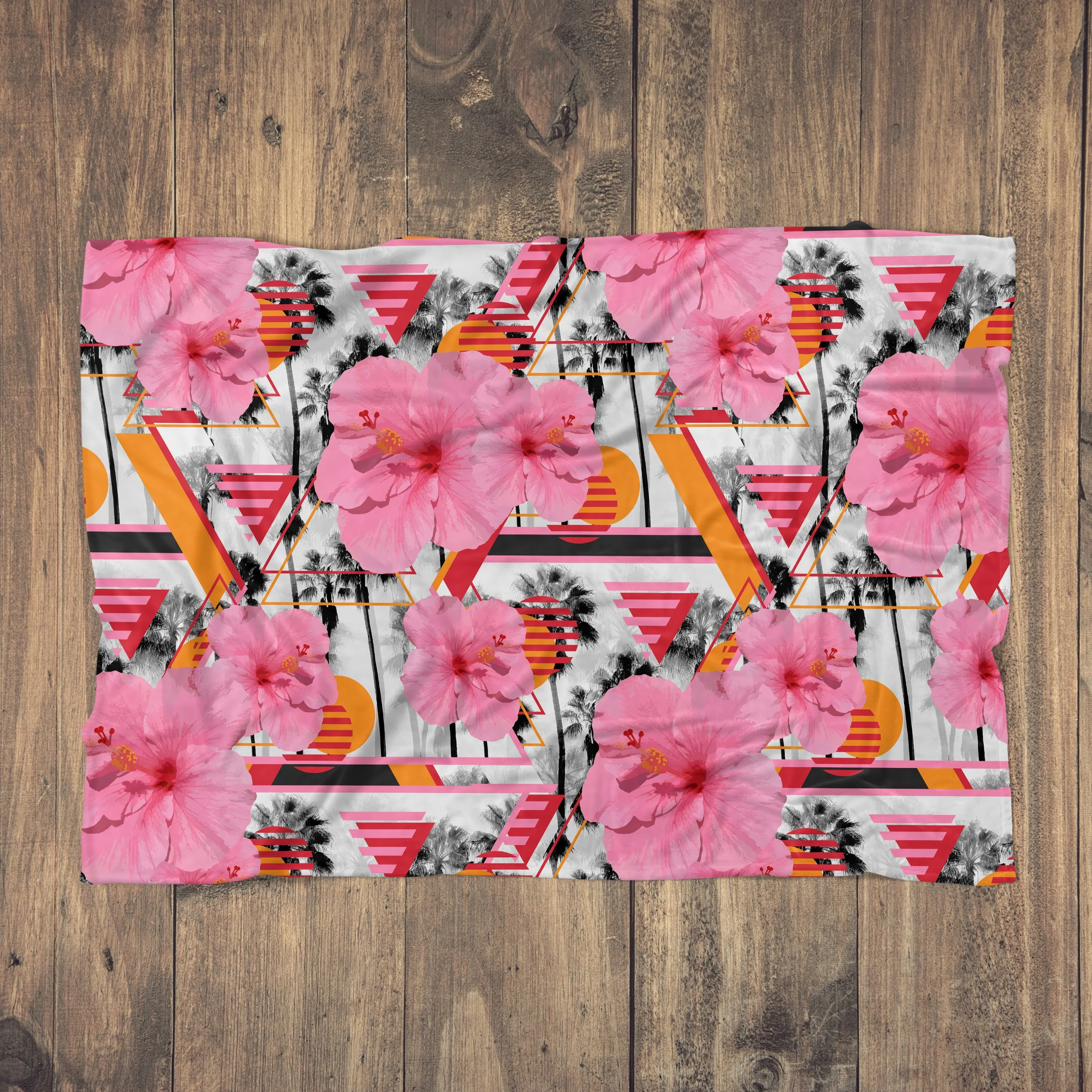 Sunset Pink Hibiscus Flowers - Fleece Blanket on Wood Floor.jpg