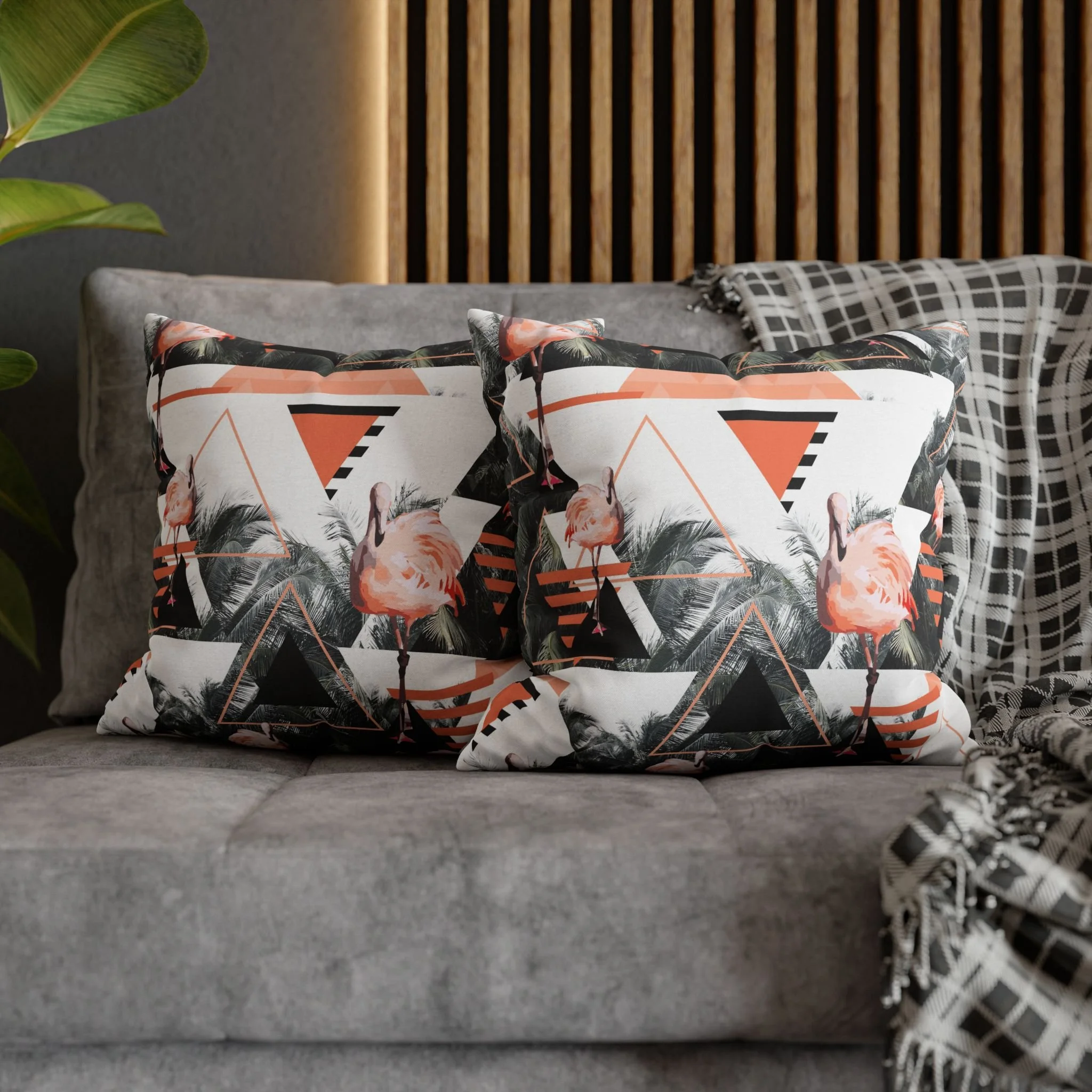 Black Beach Flamingos - Matching Pillows on Couch.png