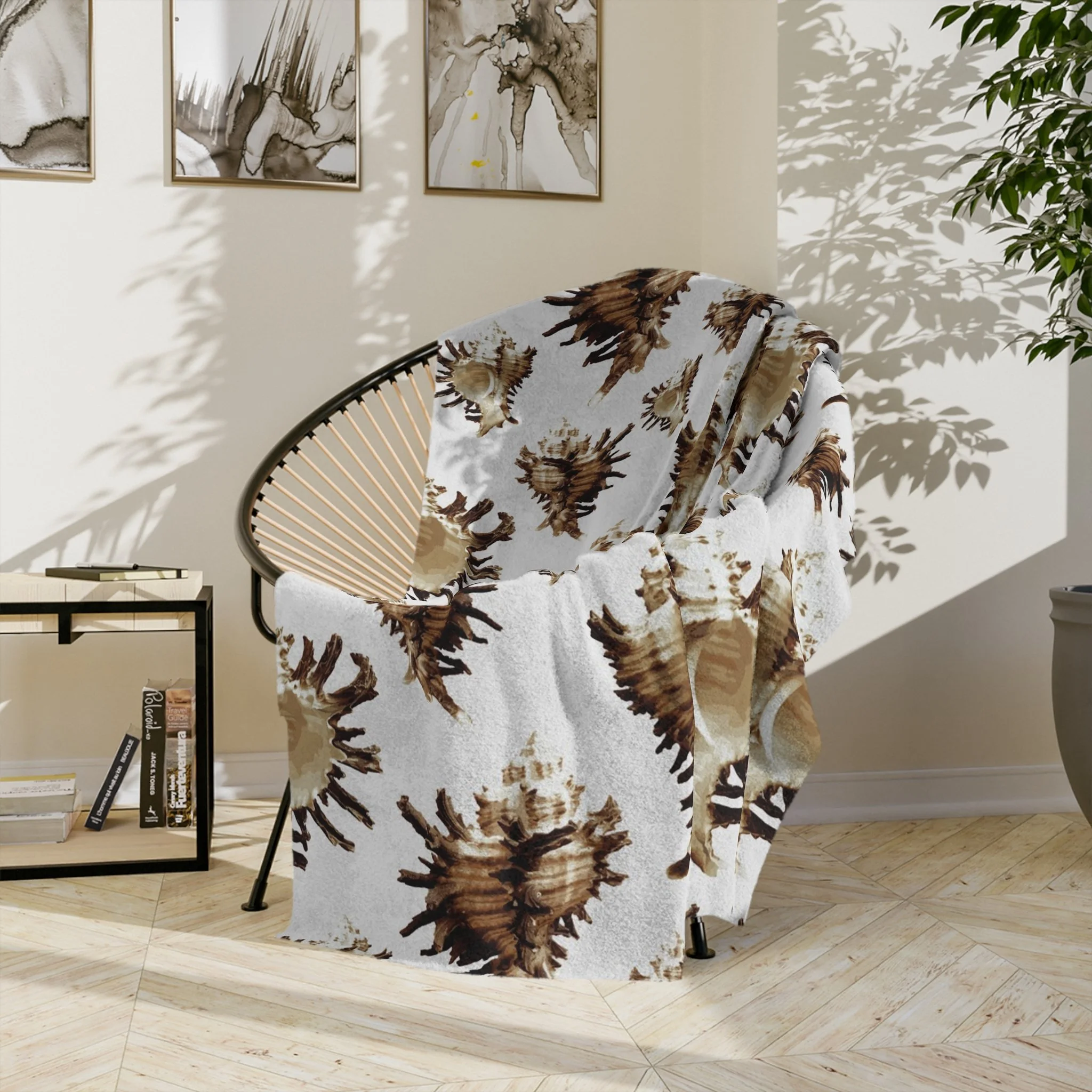 Spiky Conches (on Very Light Gray) - Fleece Blanket - On Wicker Basket Chair.png