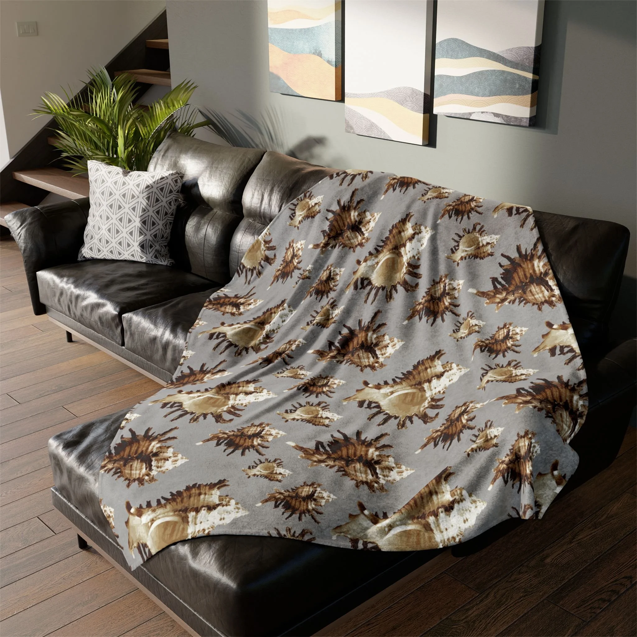 Spiky Conches (on Gray) - Fleece Blanket on L-Shaped Sectional.png