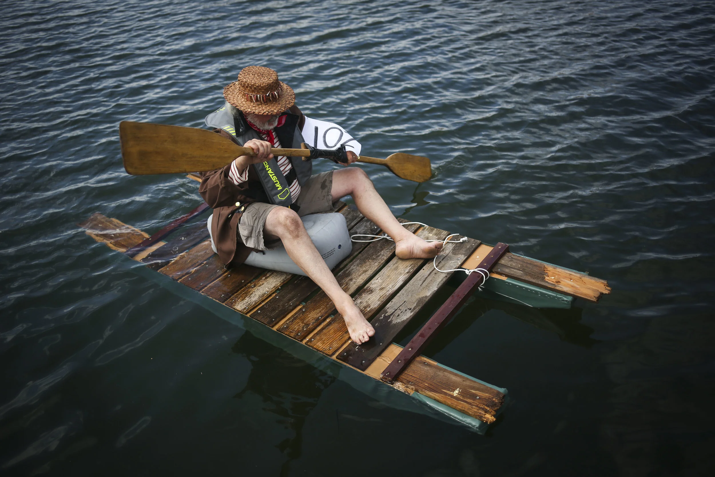 Bob Knapp, who introduced the George Raft Race to Blaine's annual Drayton Harbor Days event, attempts to keep his raft from sinking before the start of the race.