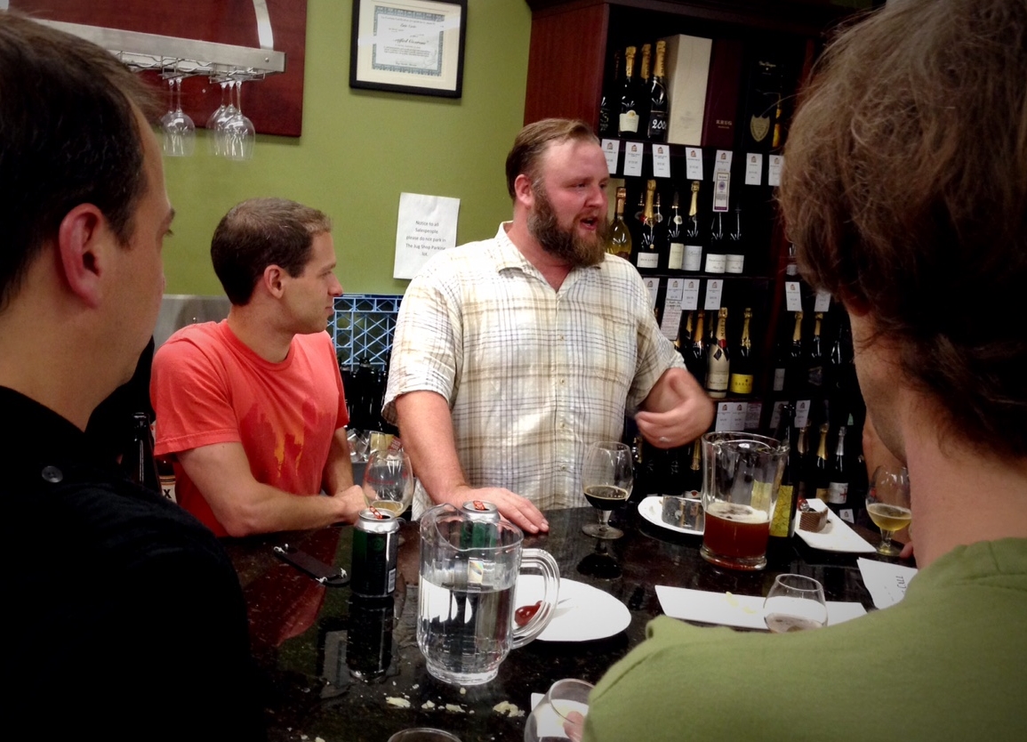 Eric Cripe talks beer with the crowd at his big "Eric's Last Call" going away tasting at The Jug Shop