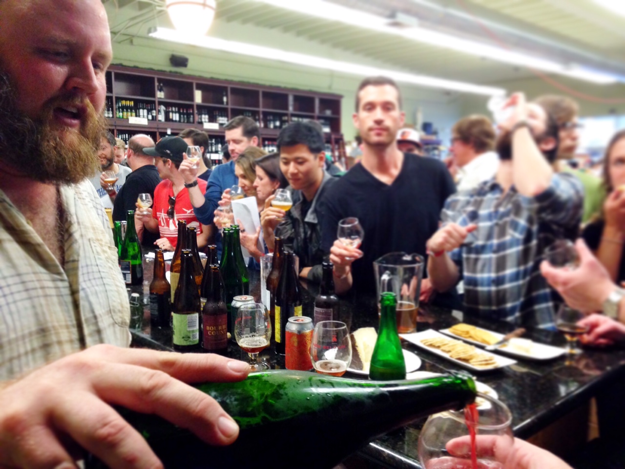 Eric Cripe pours some De Ranke Kriek for a lucky taster at the "Eric's Last Call" tasting at The Jug Shop