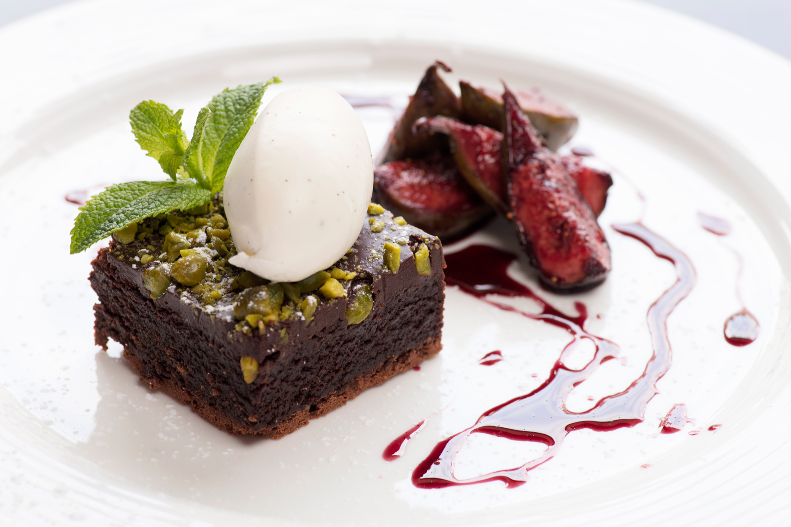 Warm Chocolate &amp; Pistachio Brownie with Creme Chantilly &amp; Red Wine Poached Figs