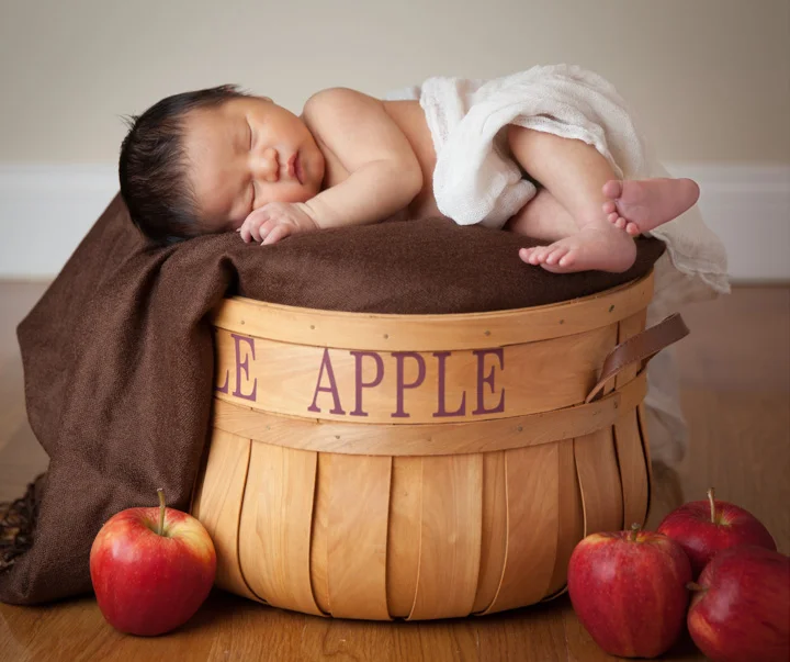 This autumn newborn was perfect for the apple picking theme we chose. We found the apple basket first, then stuck with the fall color scheme, and added real apples for detail impact