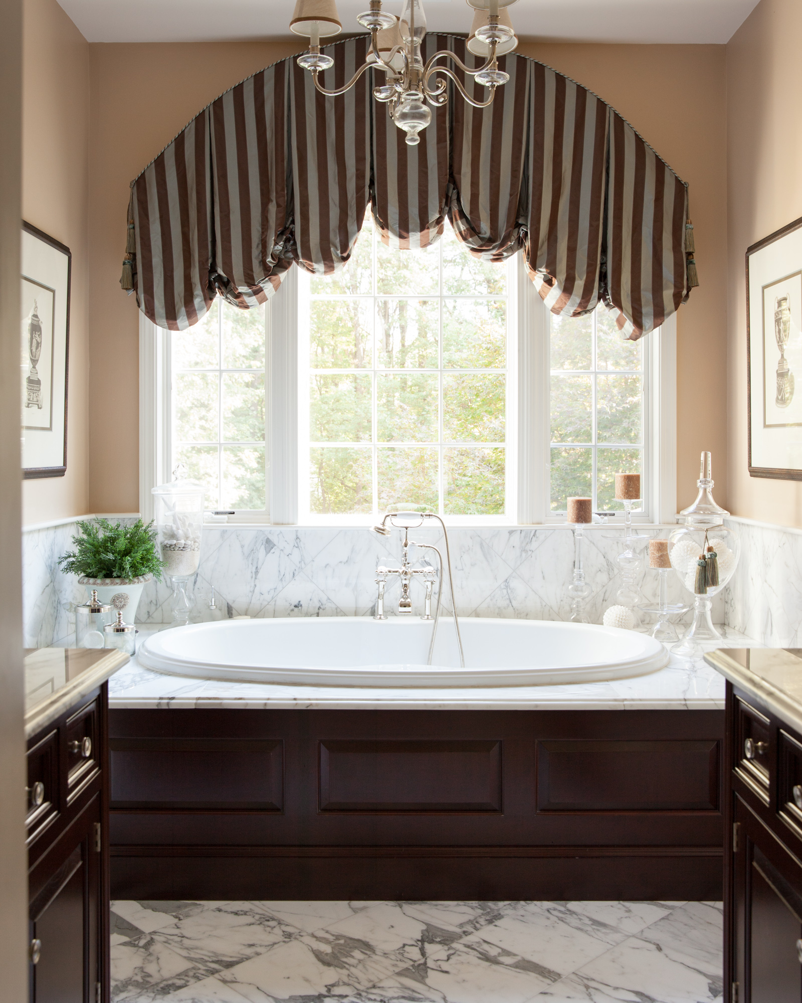 Marble back splash to match the marble floor, against dark wood made quite an impact next to the pristine white whirlpool tub.