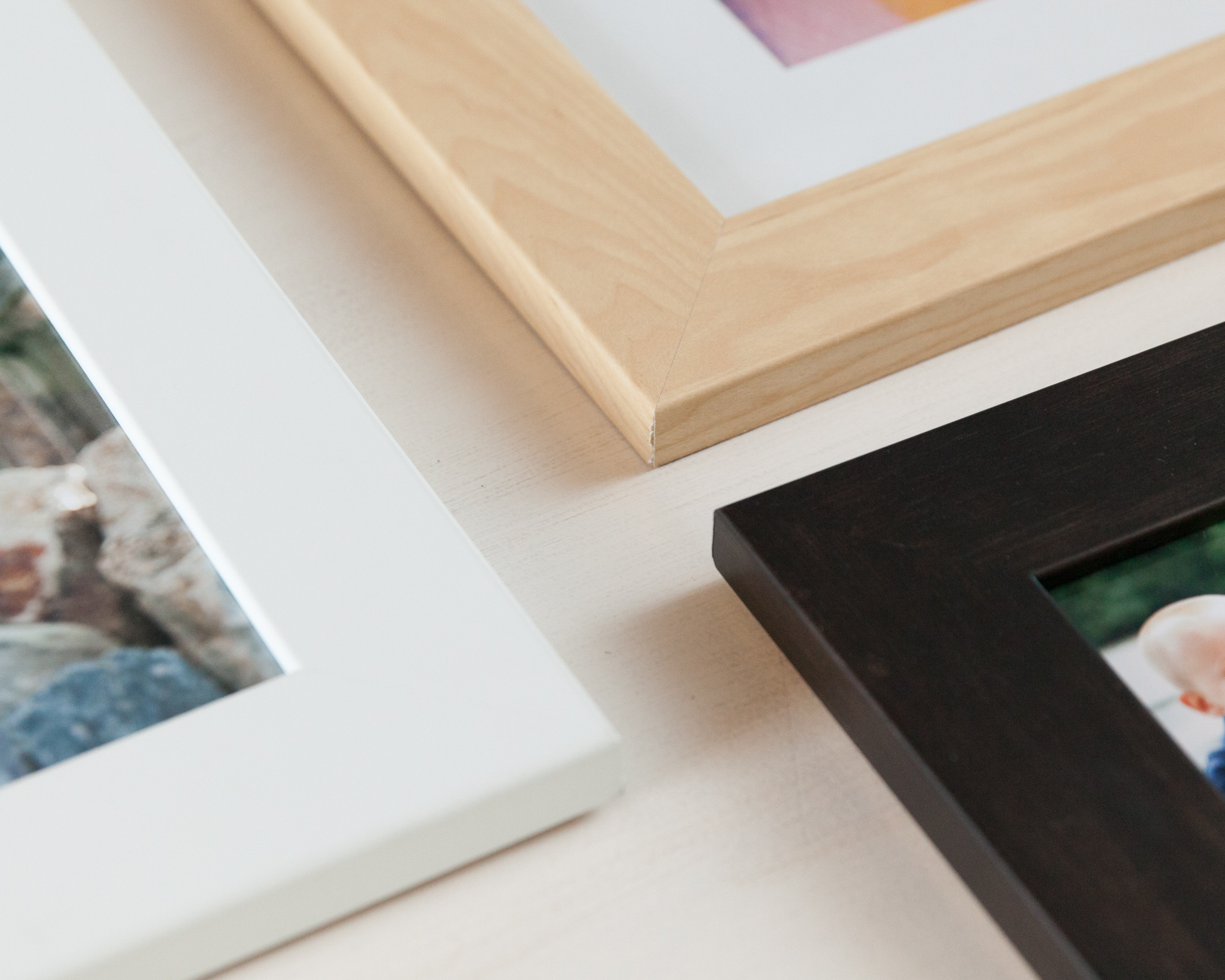 Standard wood frames come in white, light maple, and dark espresso