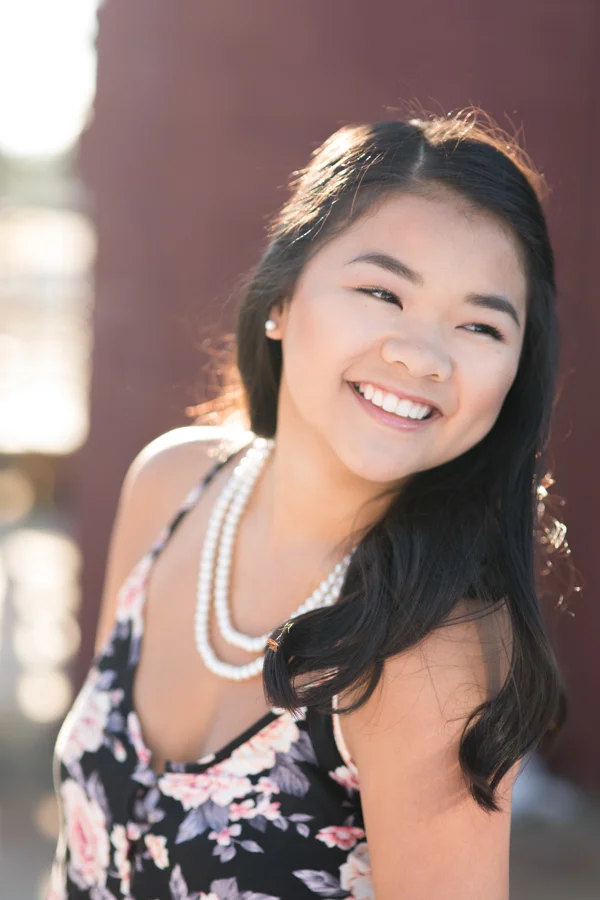 candid-laughing-pearls-teen-downtown.jpg