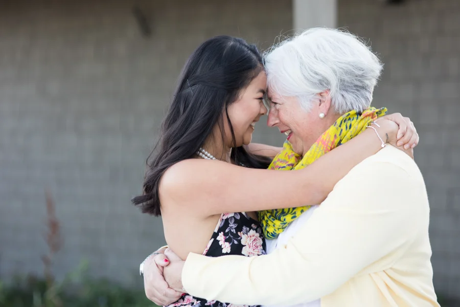 mother-daughter-hug-smile-family.jpg