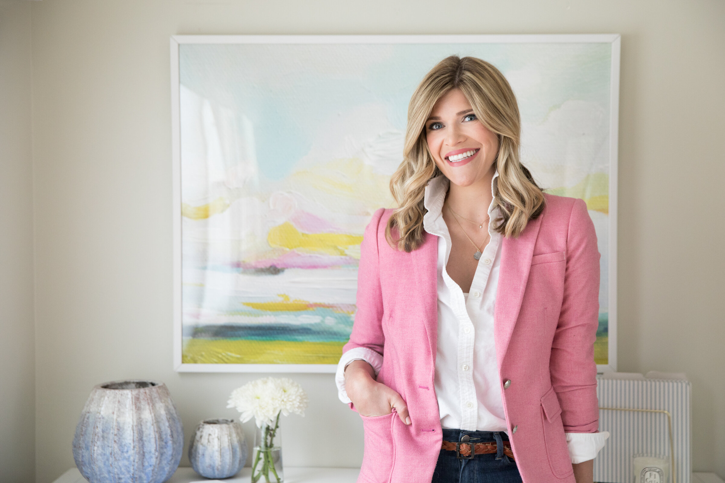 Woman in Pink blazer standing in front of artwork by Boston Brand Photographer Emily O'Brien 