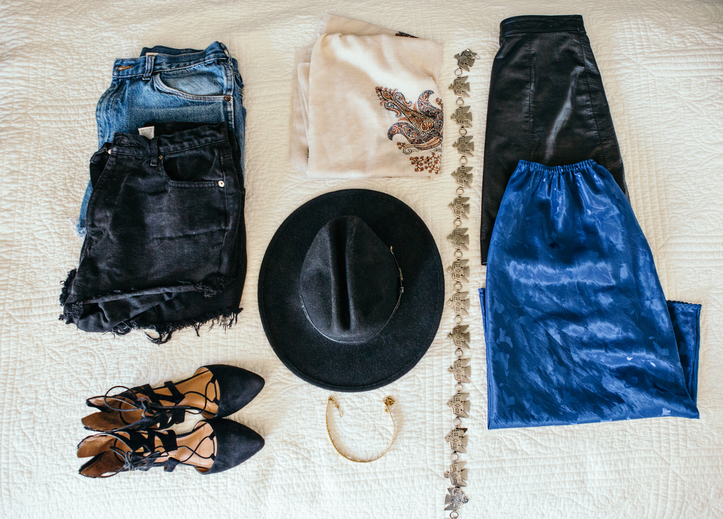 I chose my favorite pair of vintage boots, some cut offs, a leather skirt, vintage choker, a wide brimmed hat, and a colorful one or two skirts for the road. Some, but not all are pictured here.