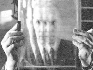 Figure 14. Professor Maurice Bonnet pears though a lenticular screen. (Photo source: newspaper L' Express, courtesy of Michéle Bonnet)
