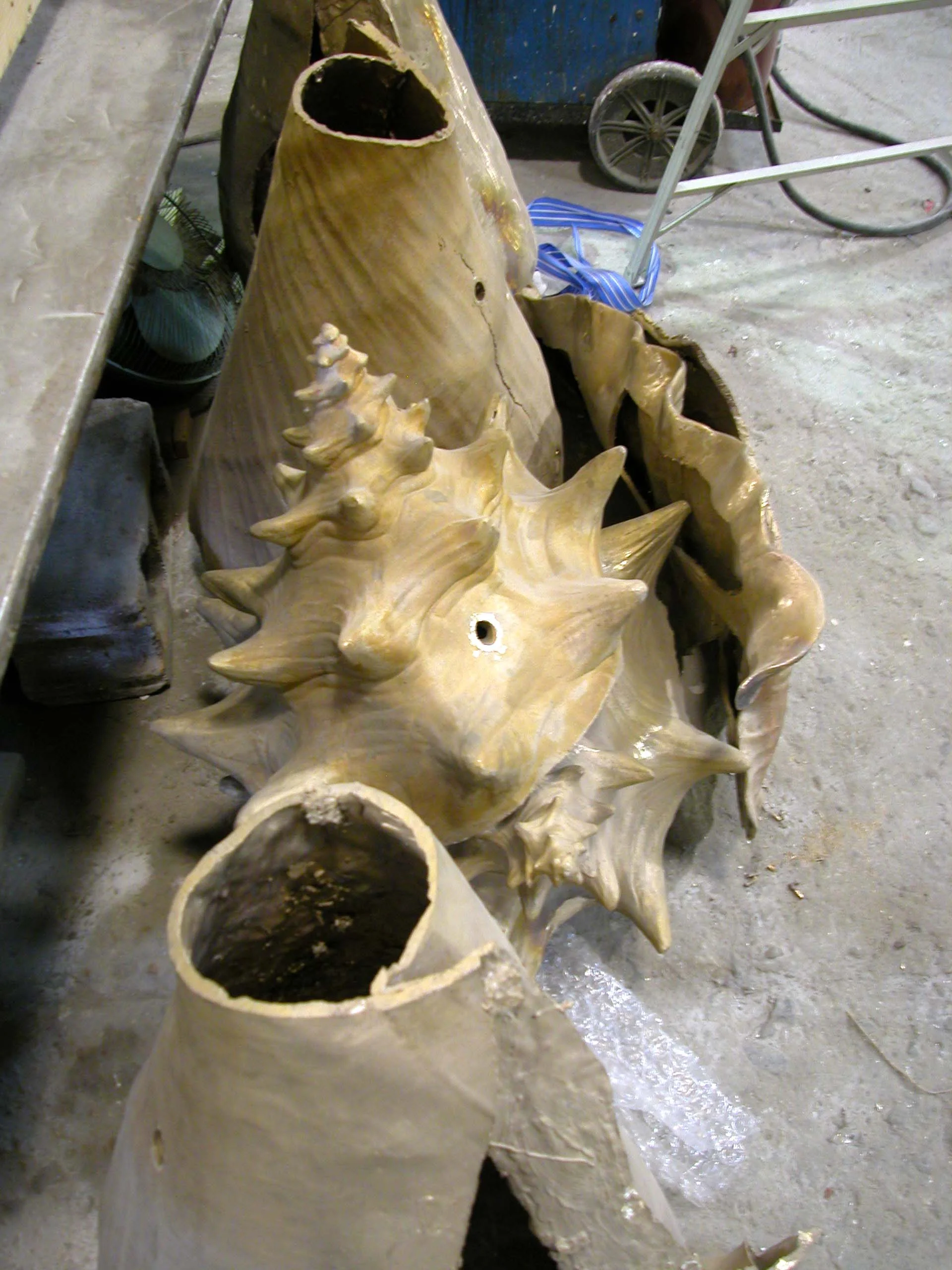 Bronze cast conch shell in parts
