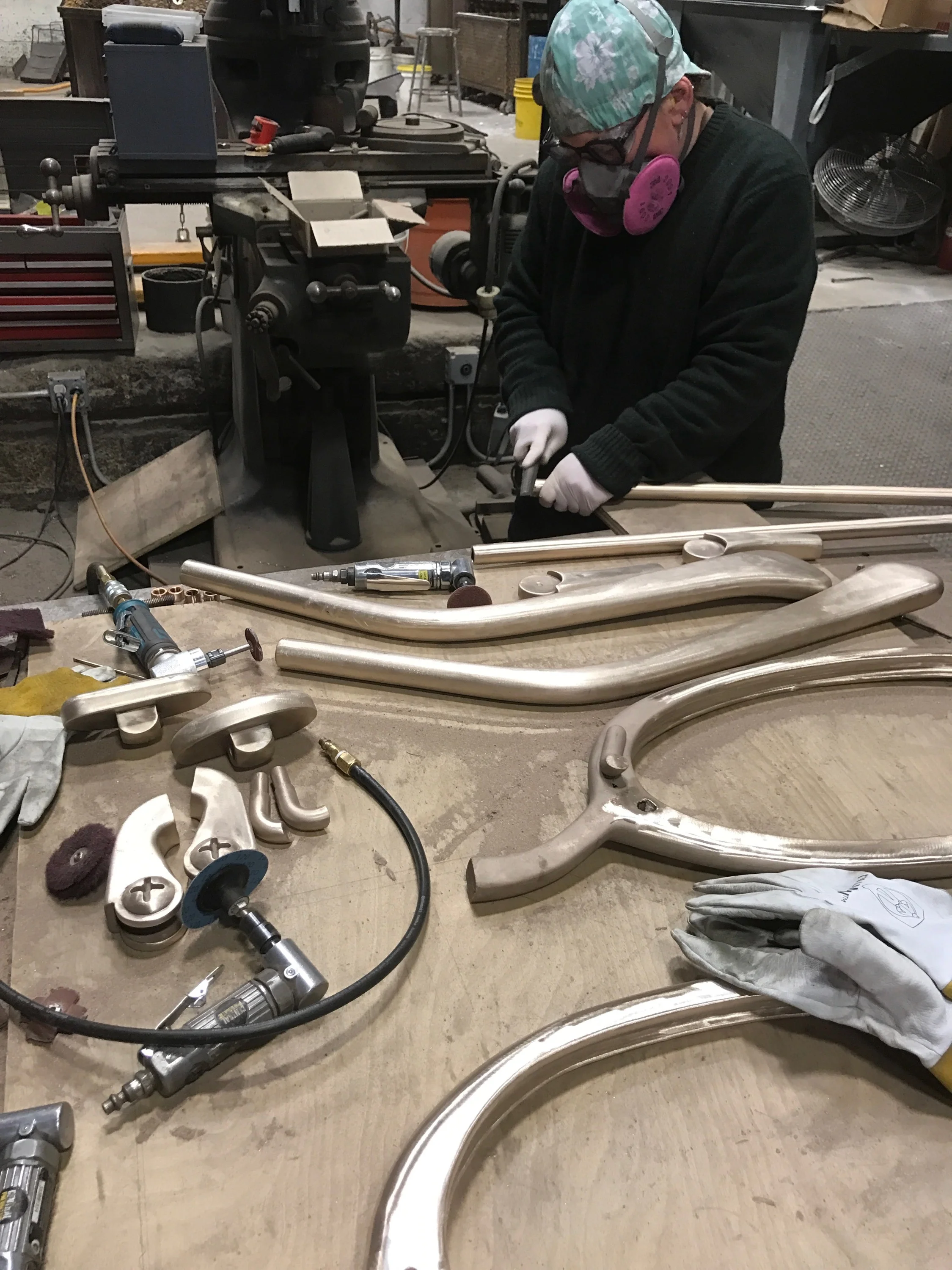 Chasing the bronze metal parts of the glasses. Photo by Dan Kendall