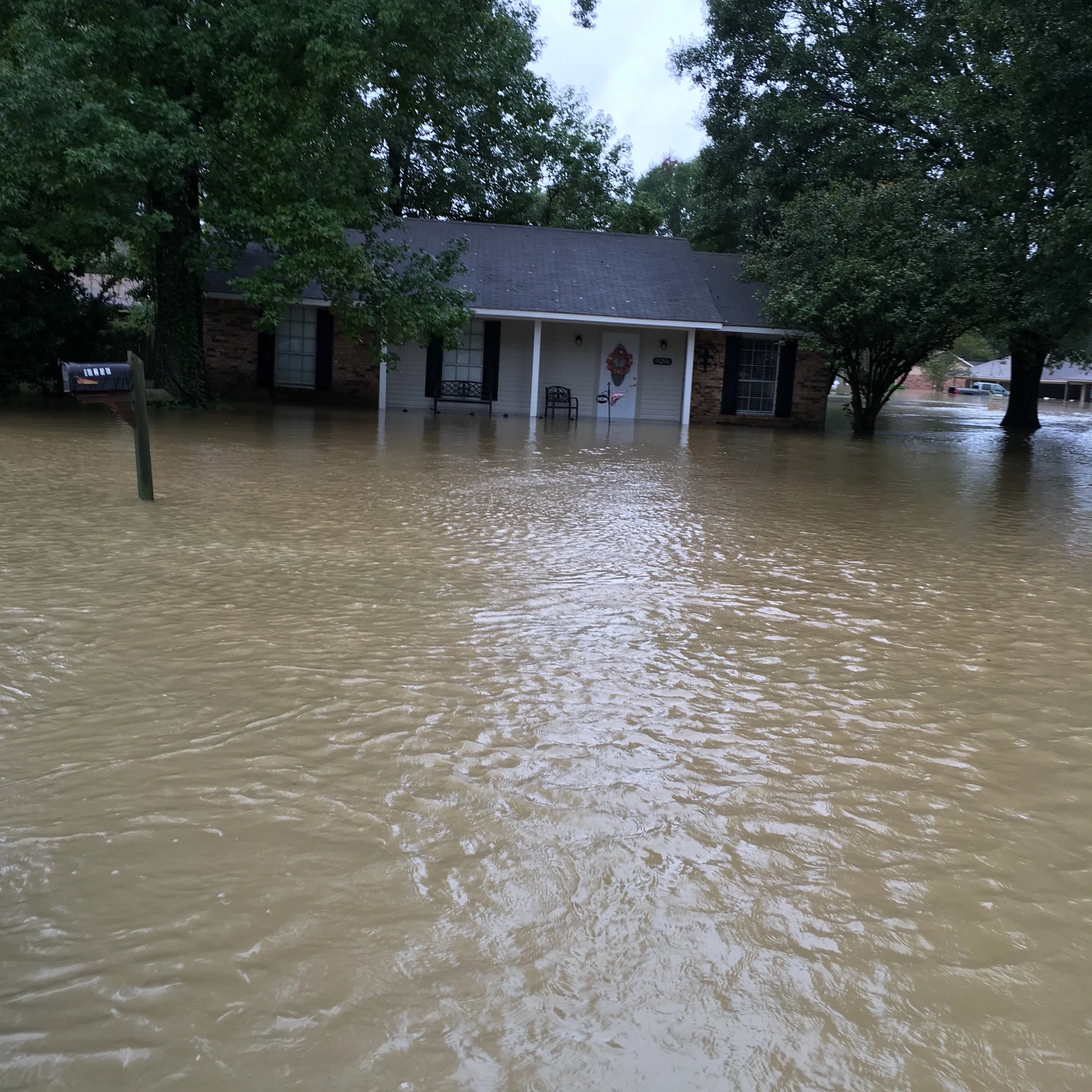 This is one of our employee's homes. The photo was taken as they were being evacuated by boat.