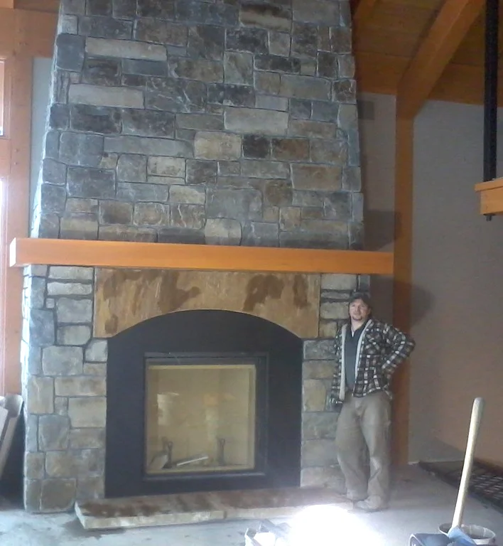 Ryan with custom Moose Mt. Ledgestone & Square's N Rec's thin veneer blend with Sandstone Lintel. 