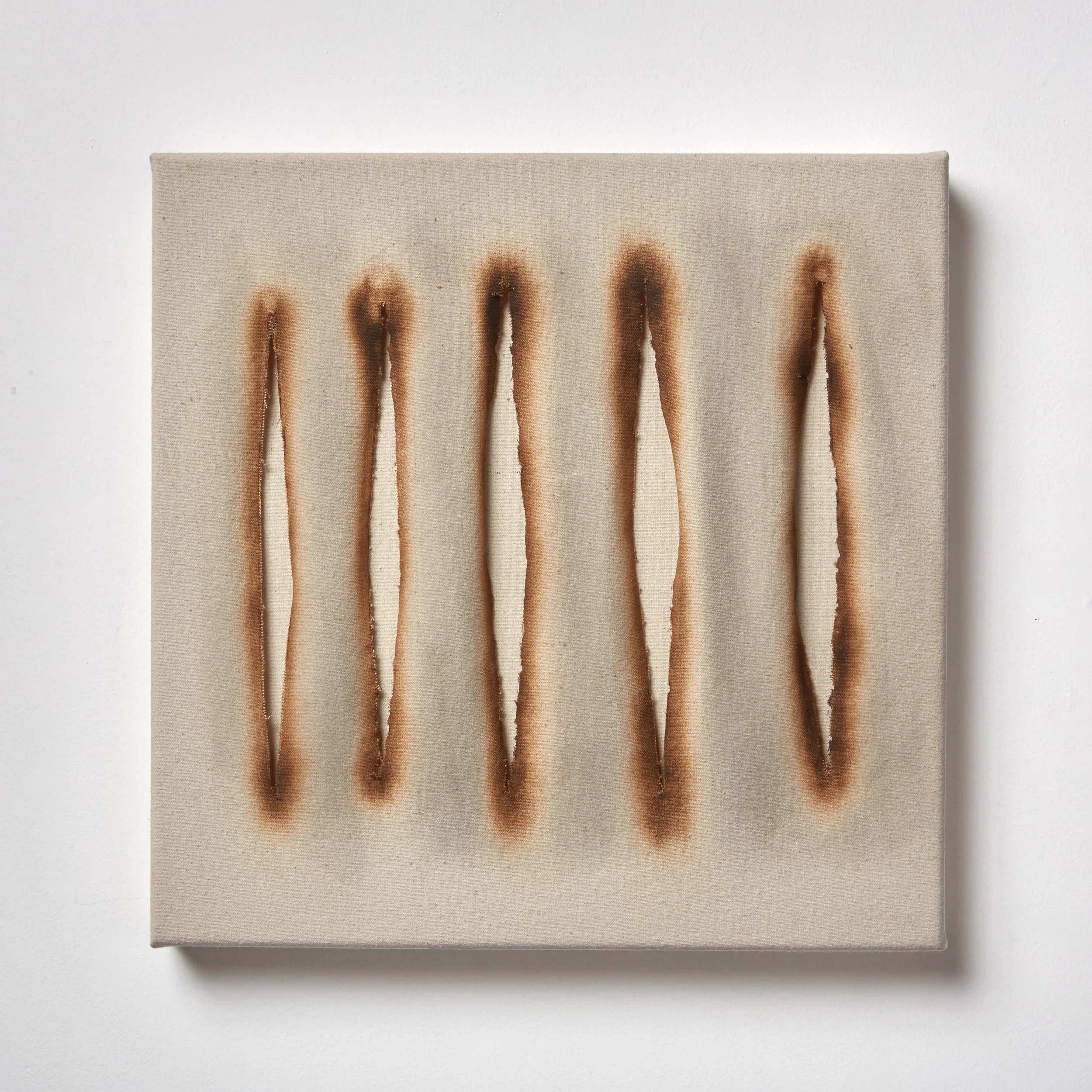  Divide, 2016 fire, metal, canvas 16" x 16" 