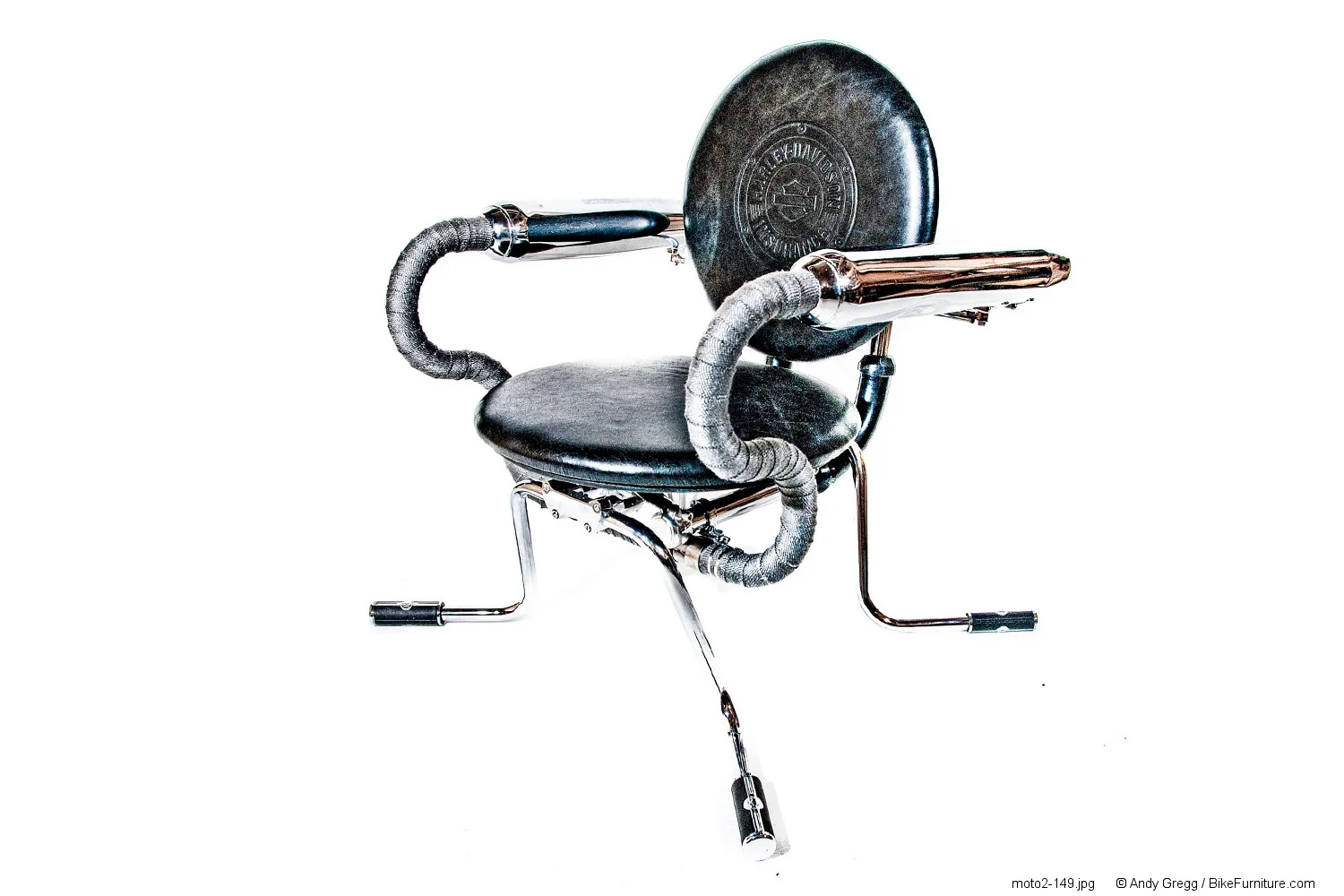 Example of a chair with a wrapped exhaust. The particular mufflers used here are on the long side. Shorter mufflers could be used to maintain a smaller footprint for the chairs. The chair also has embossed leather cushions with company logo. Another option for customizing.