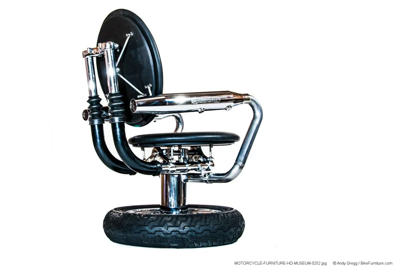 View of a chair with shorter mufflers on stainless steel exhaust tubing that is not wrapped. This also shows some detail of the mechanics of the spine of the chair, and how a column would look.
