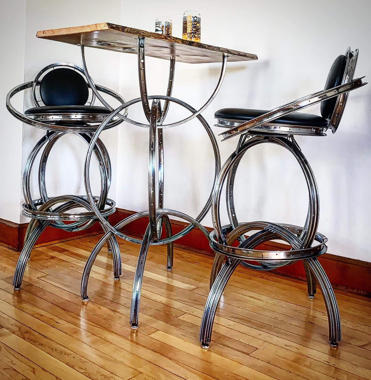 S-2 swiveling barstools and S-2 Pub Table with live-edge wood top, delivered and put into play in a residential setting. 
#bikefurniture #happycustomer #familytime #dadshouse #farmertan #lakesuperior #residentialdesign #hardwoodfloors #bardesign #ret