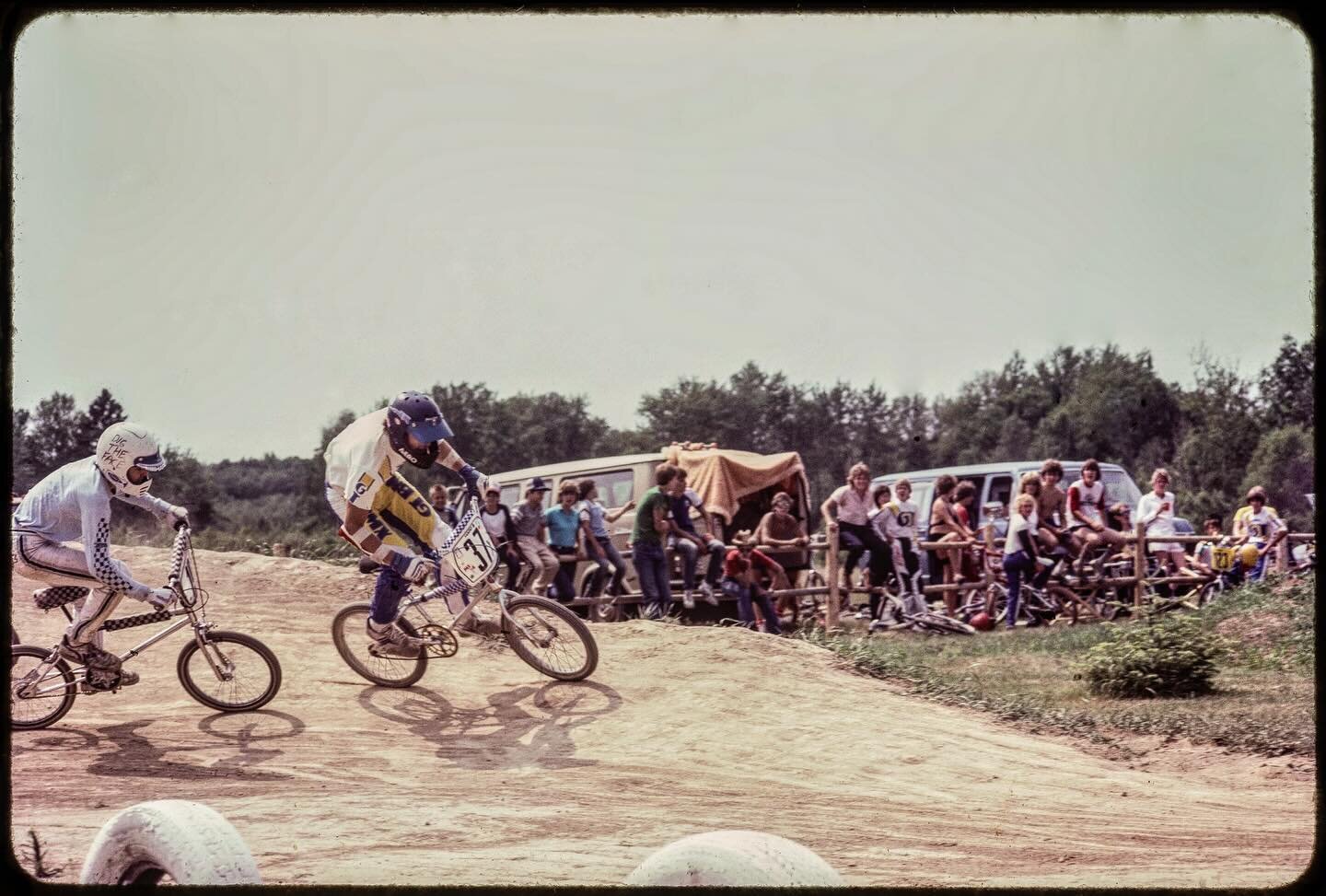Old school BMX at the Escanaba track with Matt Marenger and his gifted &rsquo;DIG THE FACE FACE&rsquo; helmet giving chase to John Duflo. The original Ektachrome slides are stamped July 1983, so it was the last summer I raced BMX before moving on to 