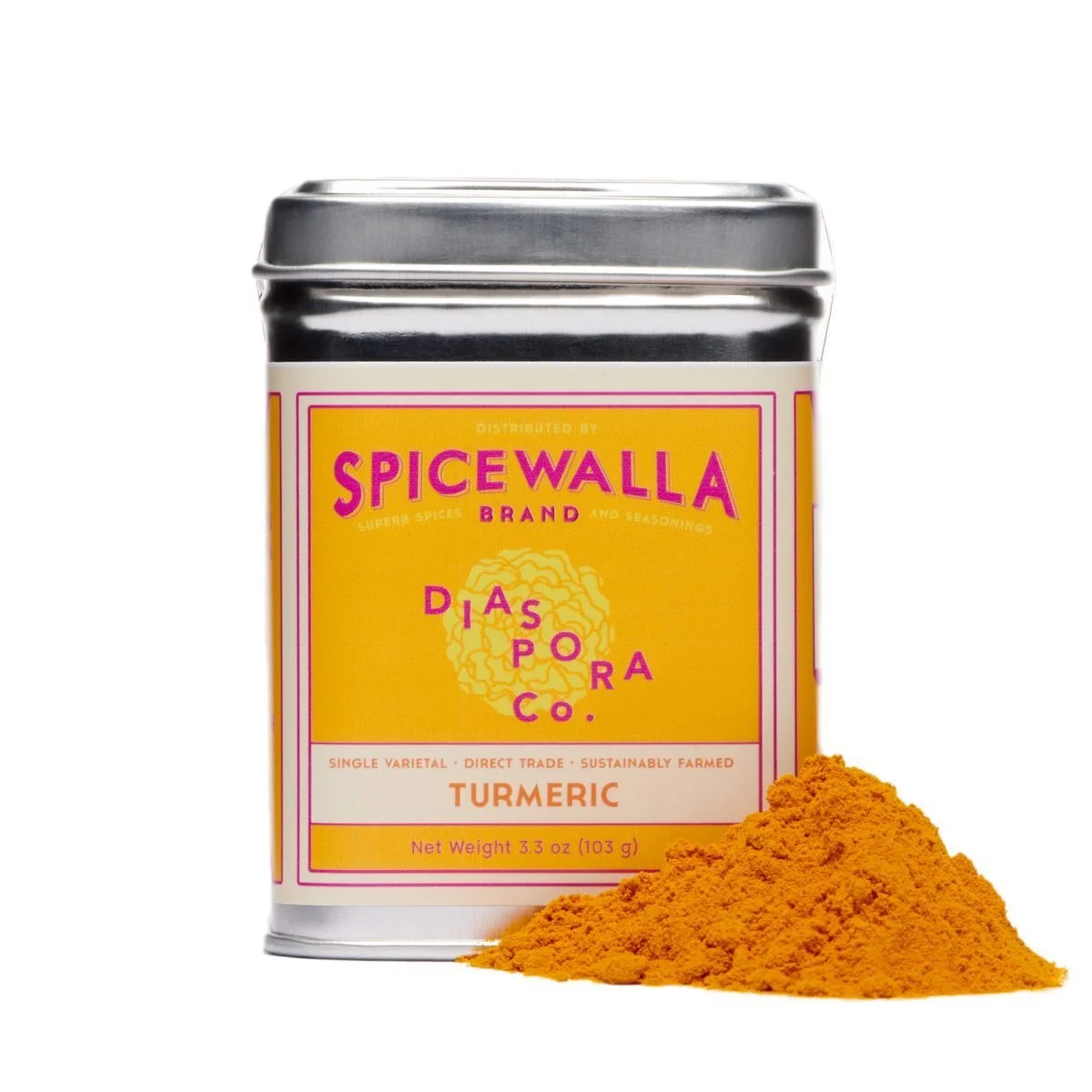 A yellow tin of turmeric beside a mound of bright orange powder on white.