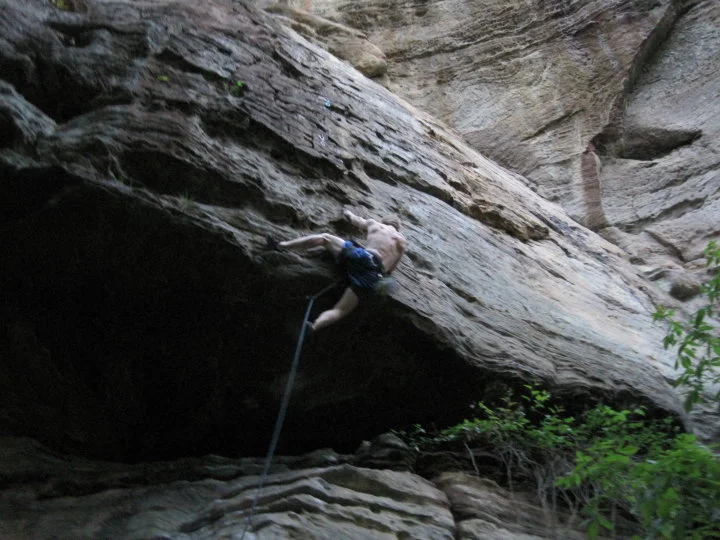 Pulling the roof on Creature Feature - a classic moderate at the Red River Gorge