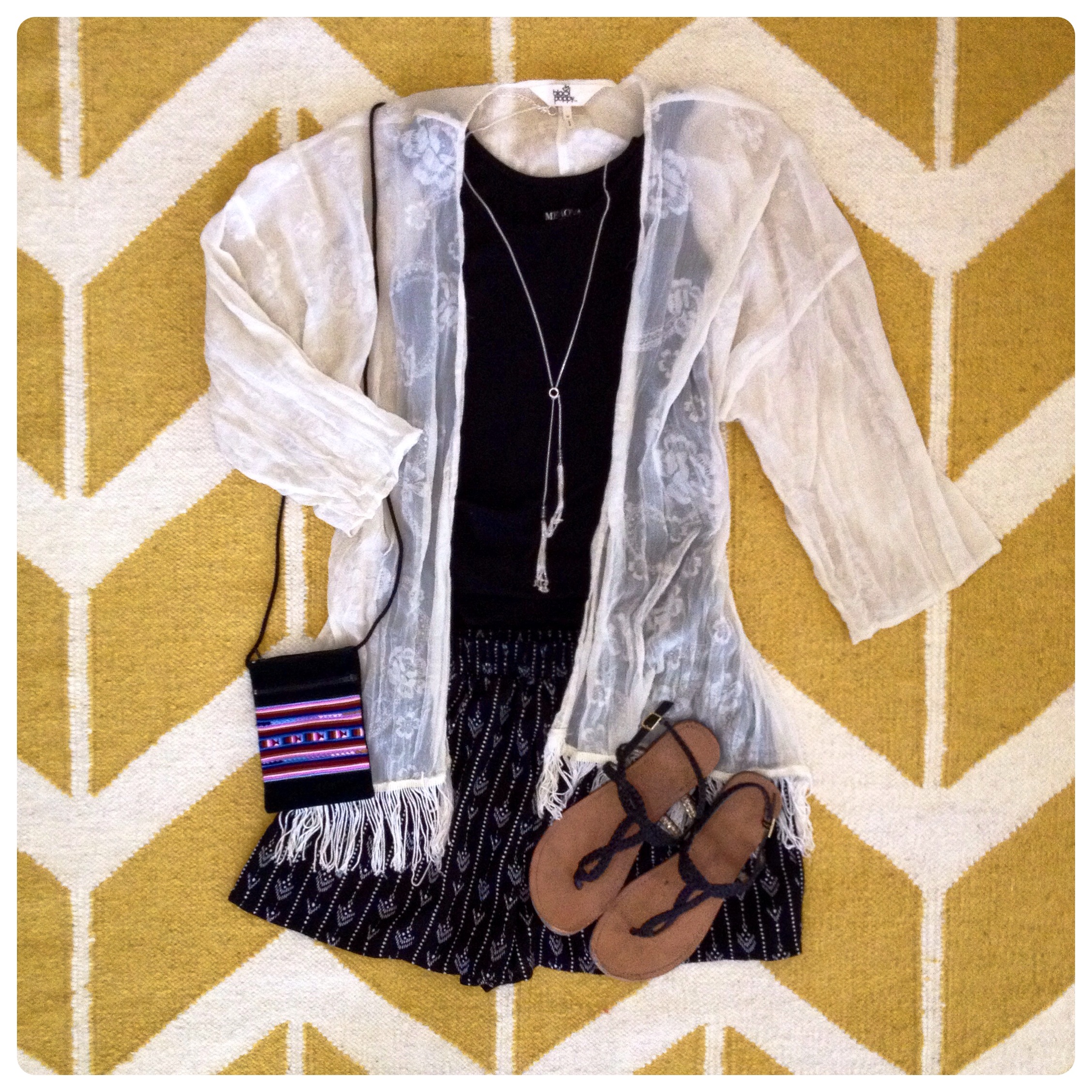 Printed Shorts - Forever 21 $11.80 These were so very comfortable and I really liked the print on them which kind of looks like rustic arrows. I thought these would pair well with the fringed ivory kimono in my closet and fit into my overall 'Pajama Chic' theme for the weekend. From My Closet: Kimono - PacSun $12 {Clearance} Mossimo Tank - Target $9 Tassle Necklace - Target $16 Sandals - Target $15 Bag - Deb's Coffee Cafe, Sommerset, WI $8