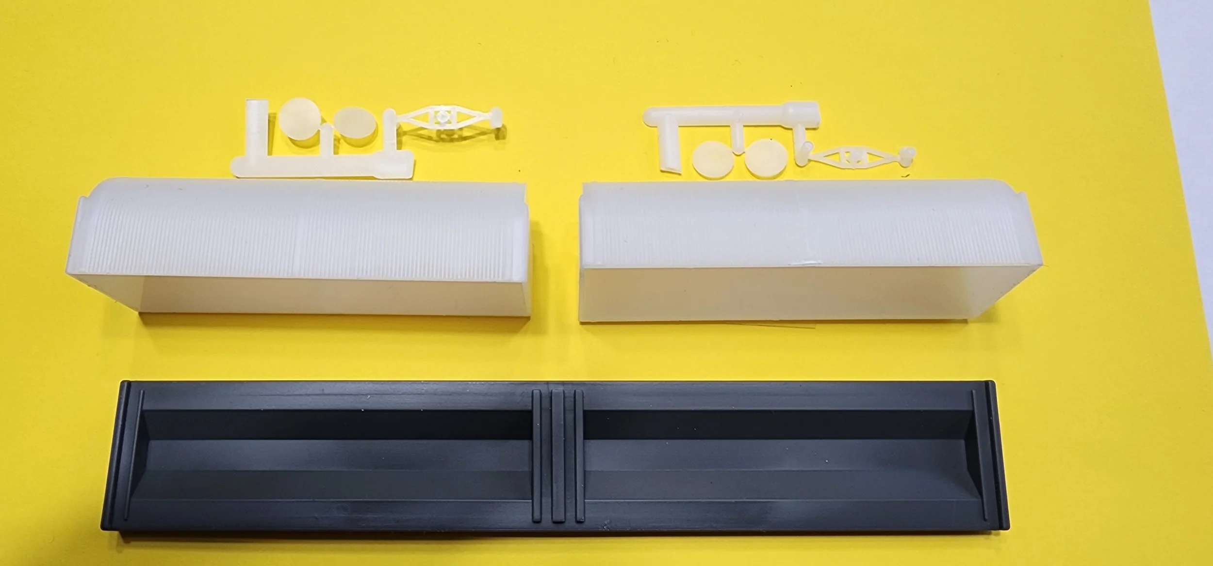 UNIVERSAL COIL CRADEL W CORRIGATED HOODS.jpg