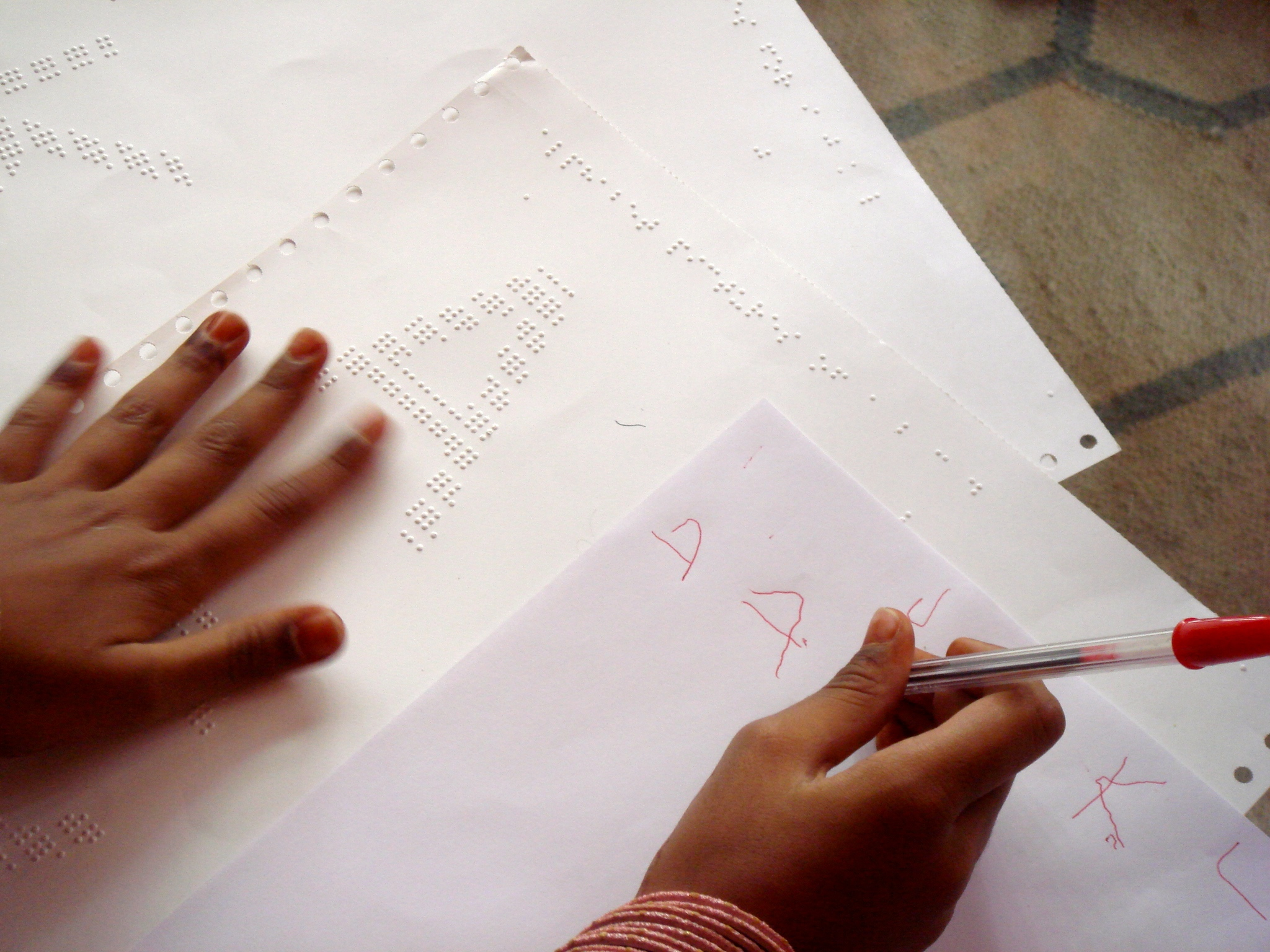 Here, she feels the image of the letter ‘A' to sense its overall shape