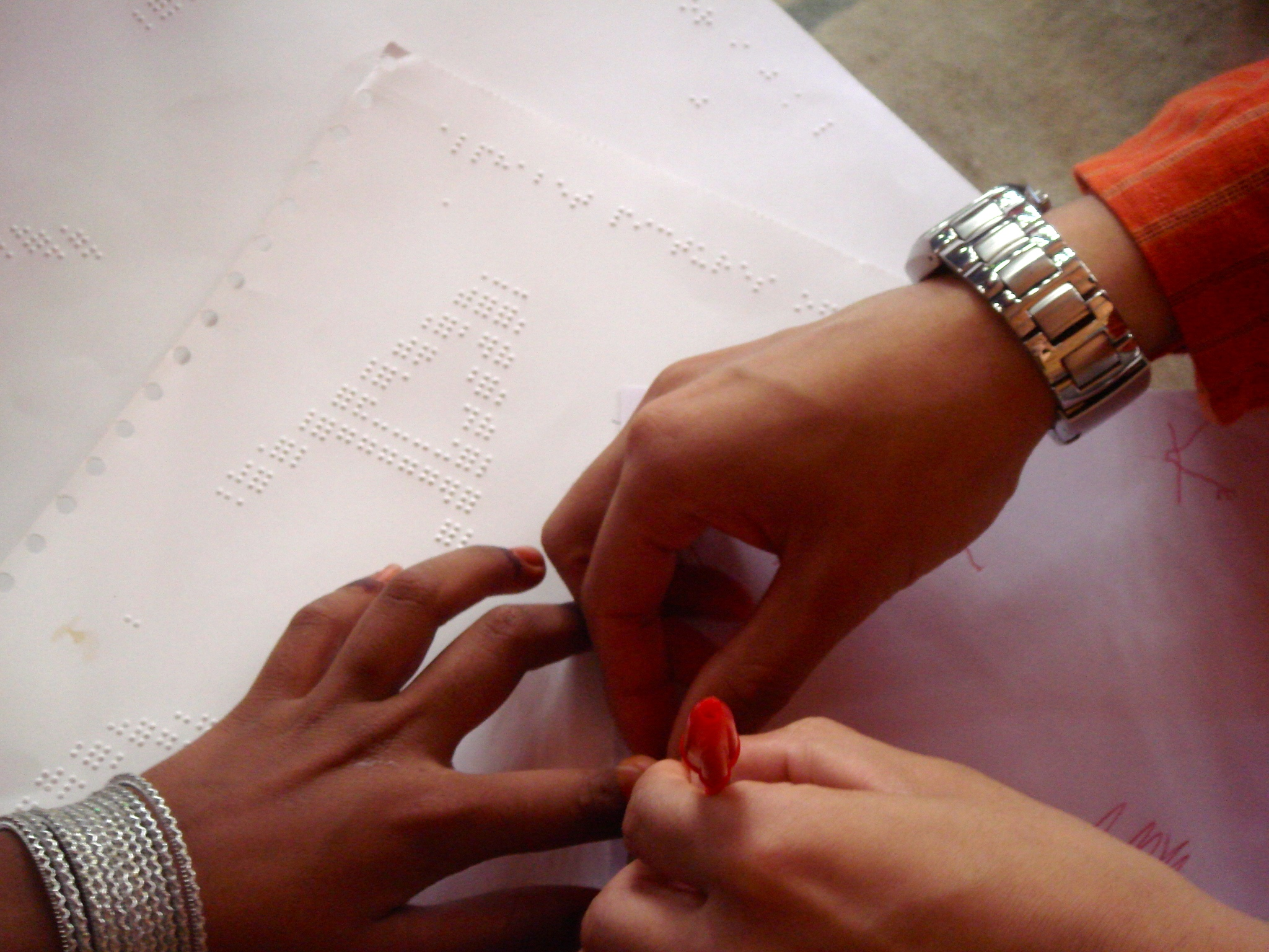    In the “handwriting" experiment, we showed a blind student how to identify the shape of letters and use a pen 