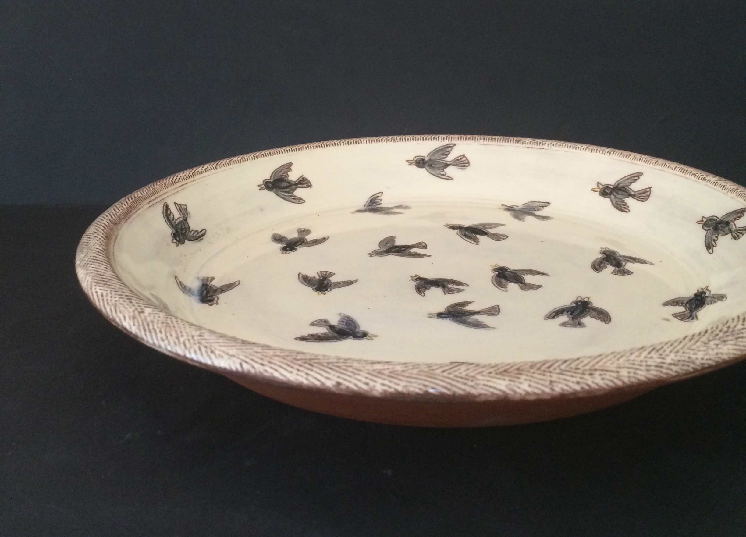 four and twenty black birds ready to be baked in a pie... each bird are individually painted and outlined, and yes 24 black birds per each pie dish!