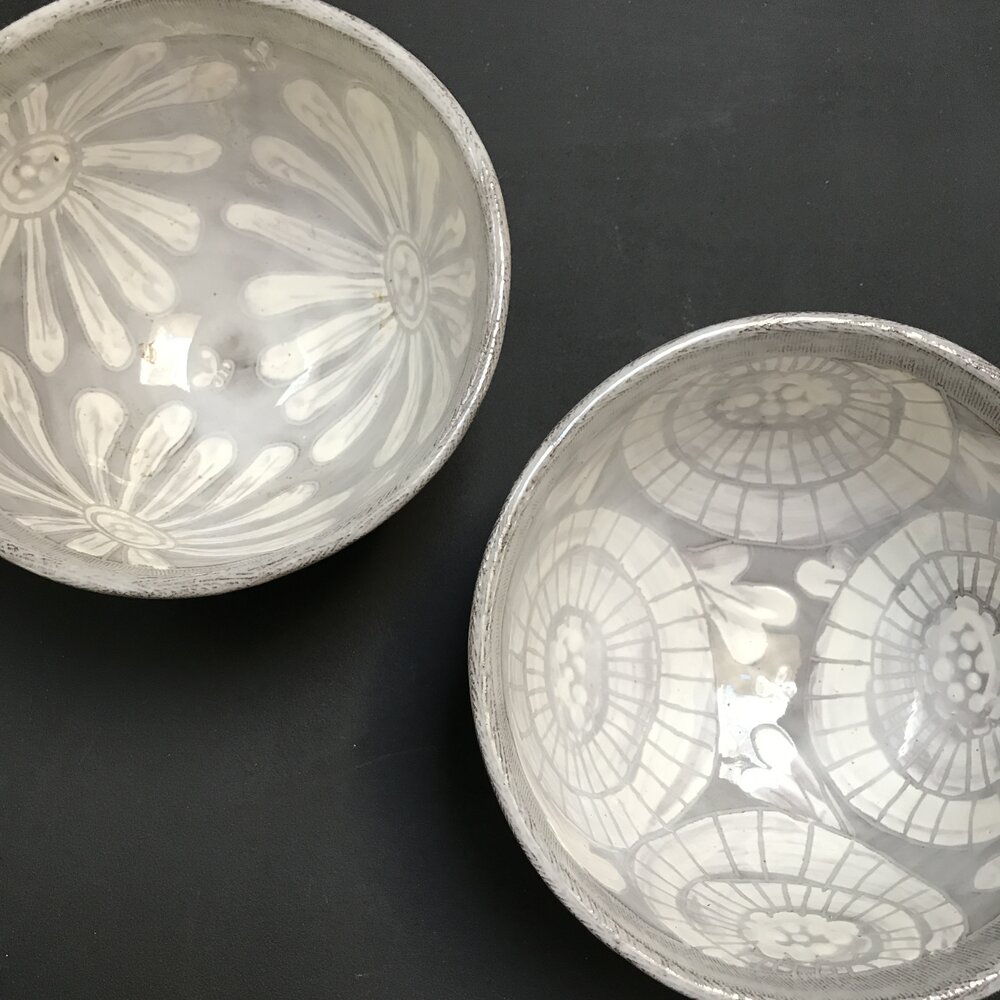 I began making my 'white on white' floral pottery as my staple for my business