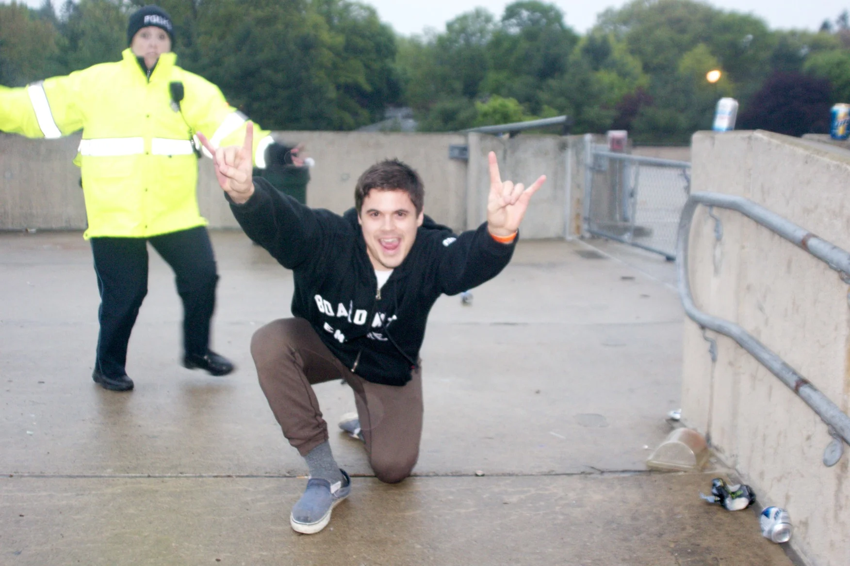 A Boston College Police officer photo-bombs during a celebratory photograph for posterity. 6:03am on 23 May 2011