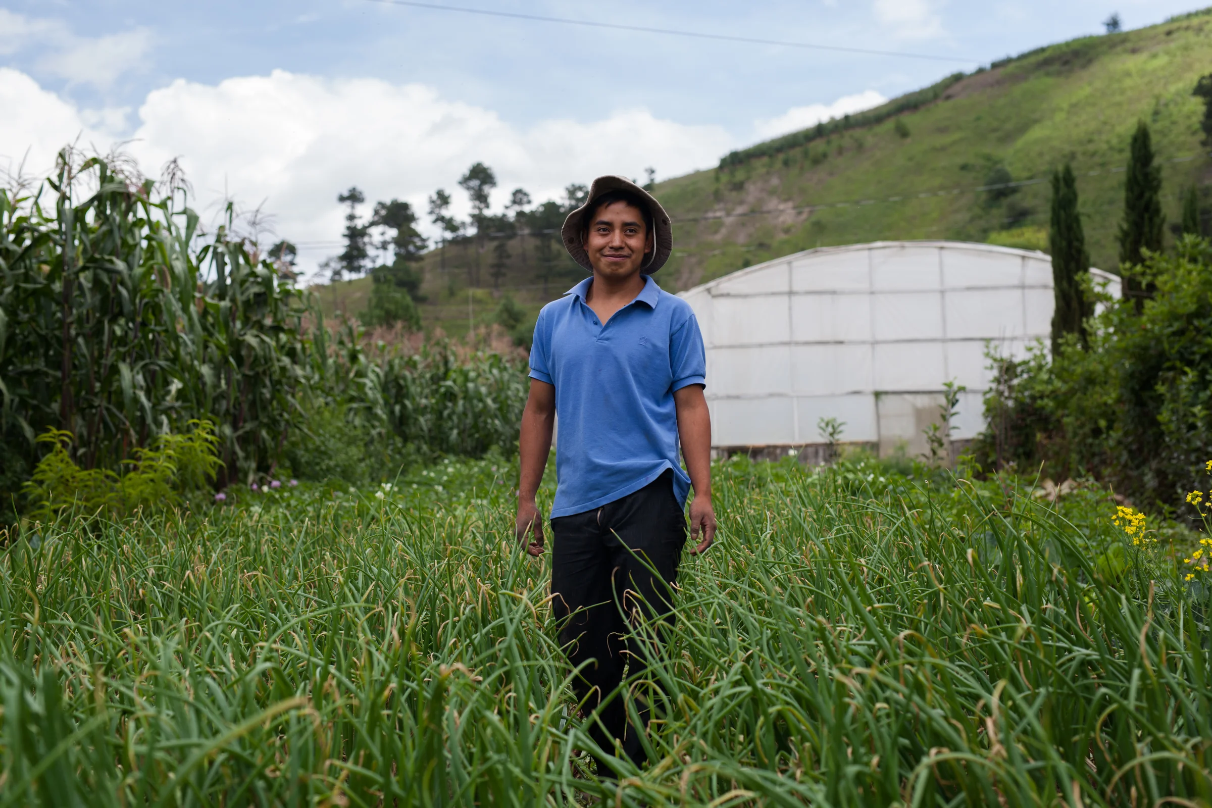 Martin - whom Jesse interviewed - here, posed for a portrait among a plot of red onions at a local seed farm. He began learning how to work the land in high school, then became fast-tracked to learn organic farming practices. When returning to his community, he received negative response from friends and family, who couldn't grasp why he might want to slowly grow produce at the start, and why he would spend the extra time and money; he aims to change the minds of his community.