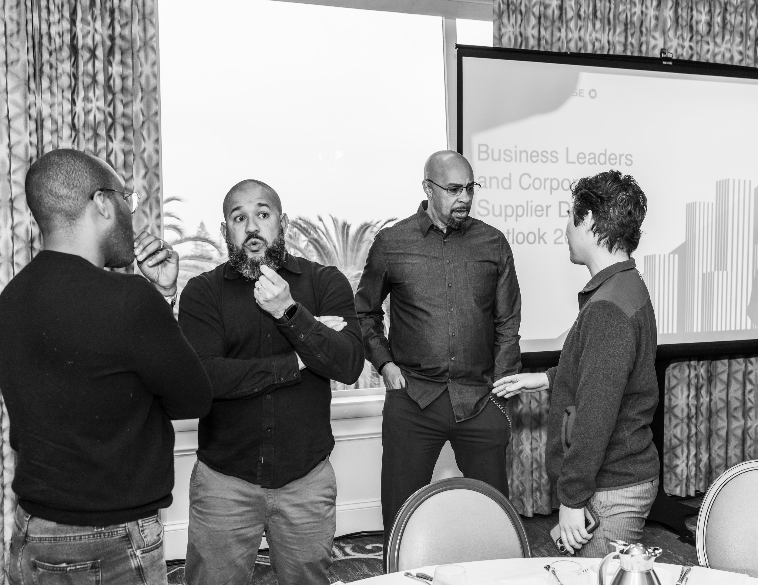 Jason speaks with a business owner at an event.