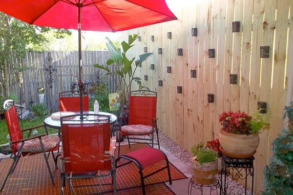 A privacy fence was a great investment for this homeowner (and any future buyers), considering her safety-minded neighbor loves mounted outdoor cameras. Image: Lee Niata Johnson from Little Bitty Damn Houze blog