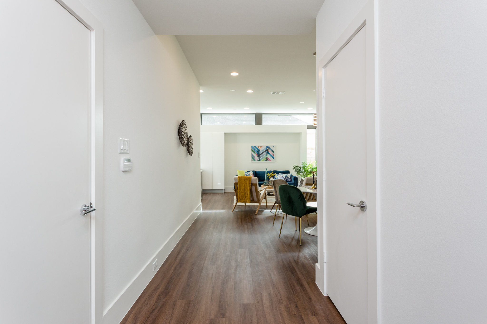  Prepare to be impressed when you enter this polished urban retreat. The door to the attached two-car garage is pictured at left and the discreetly located power room is through the door on the right. 